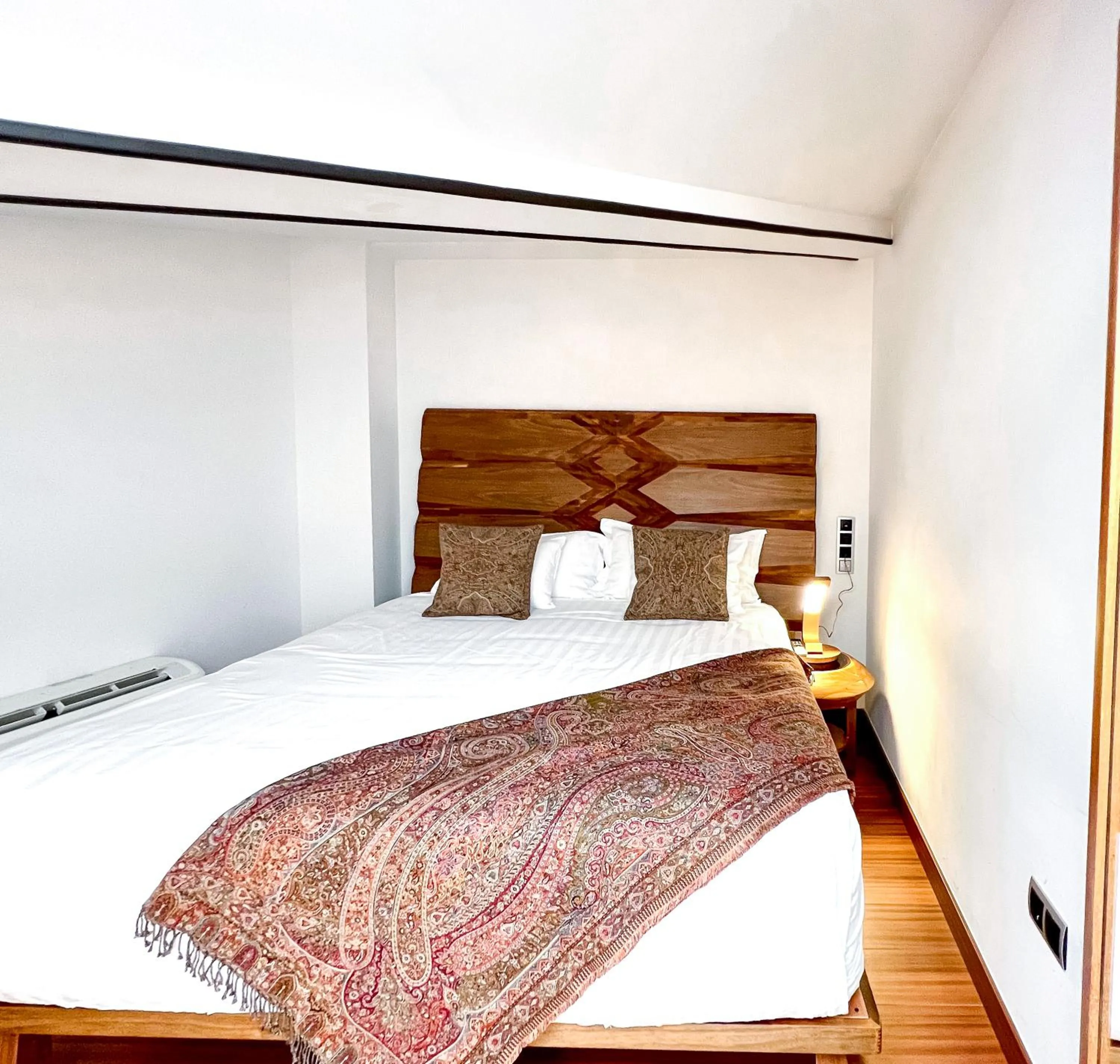 Bed in Anahita Boutique Hotel