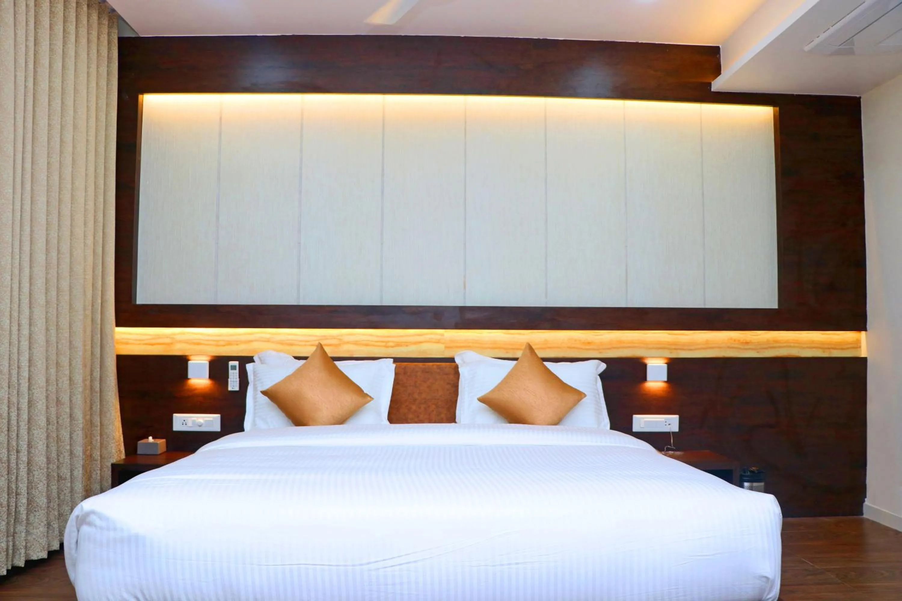 Bed in THE GRAND ASTORIA SOMANTH by Shivalaya Darshanam