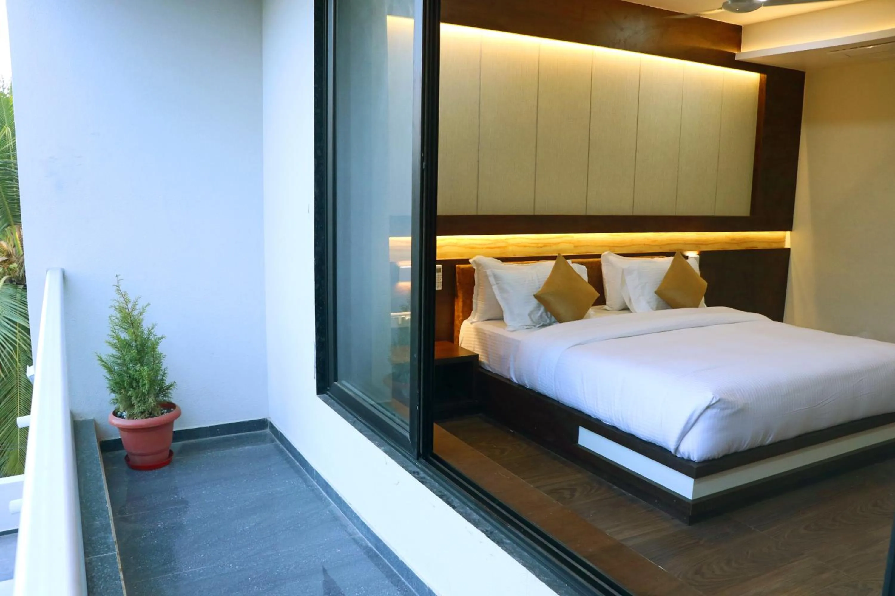 Balcony/Terrace, Bed in THE GRAND ASTORIA SOMANTH by Shivalaya Darshanam