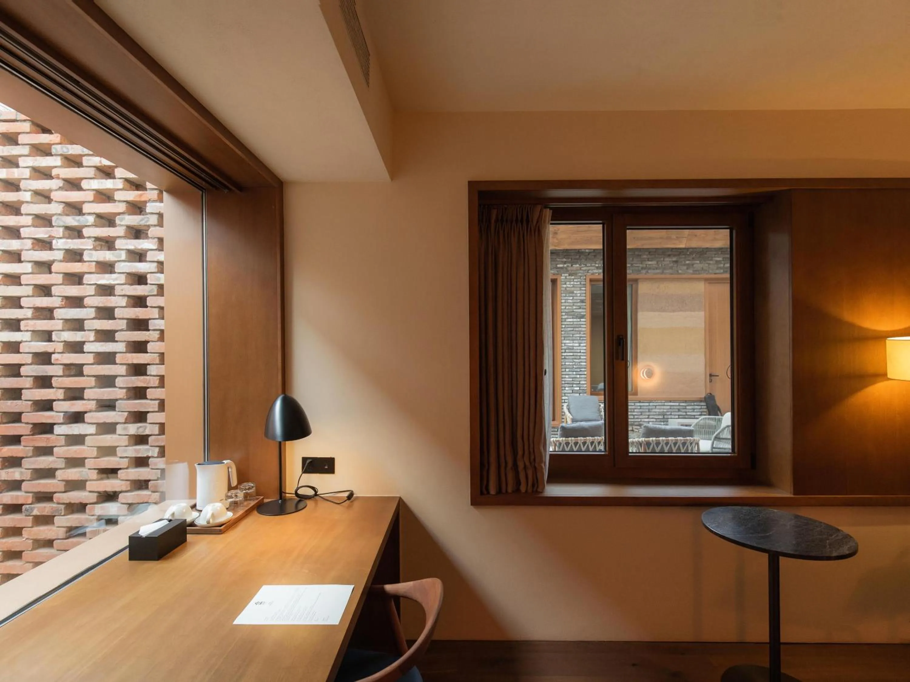 Seating area in Sansa Village Boutique Hotel at Mutianyu Great Wall Adjoin to Mutianyu Great Wall - Room with the View of Great Wall - Jacuzzi with the View of Great Wall - Vehicle Shuttle Service - International Catering - SPA& Nail Beauty Facilities