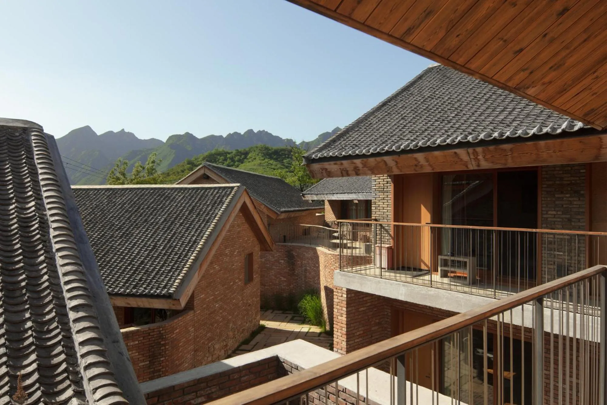 Property building in Sansa Village Boutique Hotel at Mutianyu Great Wall Adjoin to Mutianyu Great Wall - Room with the View of Great Wall - Jacuzzi with the View of Great Wall - Vehicle Shuttle Service - International Catering - SPA& Nail Beauty Facilities