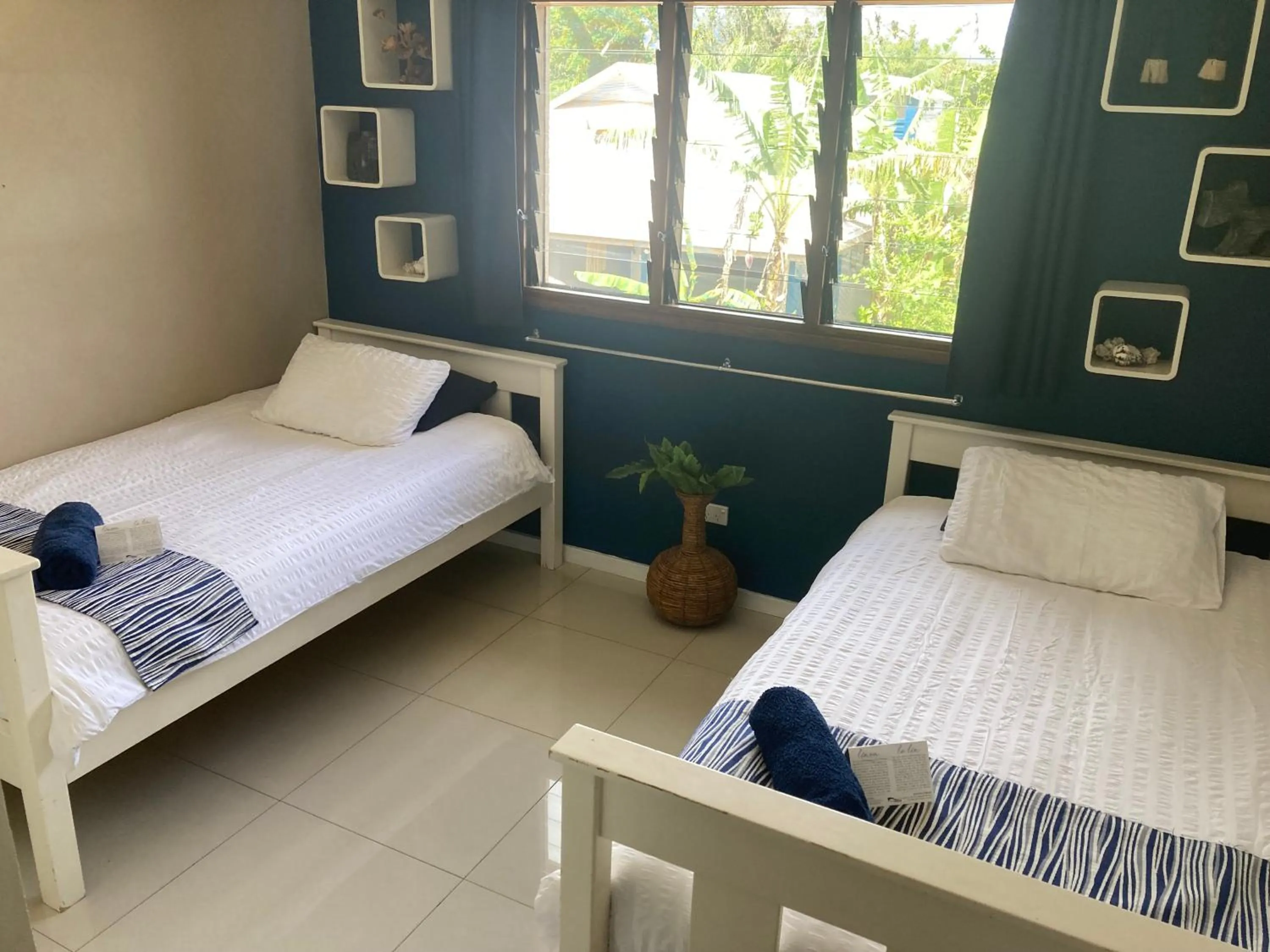 Bed in Vanuatu Beachfront Apartments