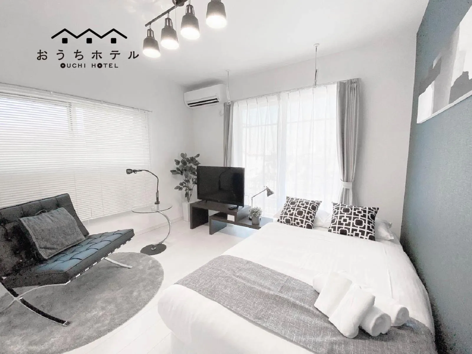 Bed in OUCHI HOTEL Hatsukaichi-Ekimae