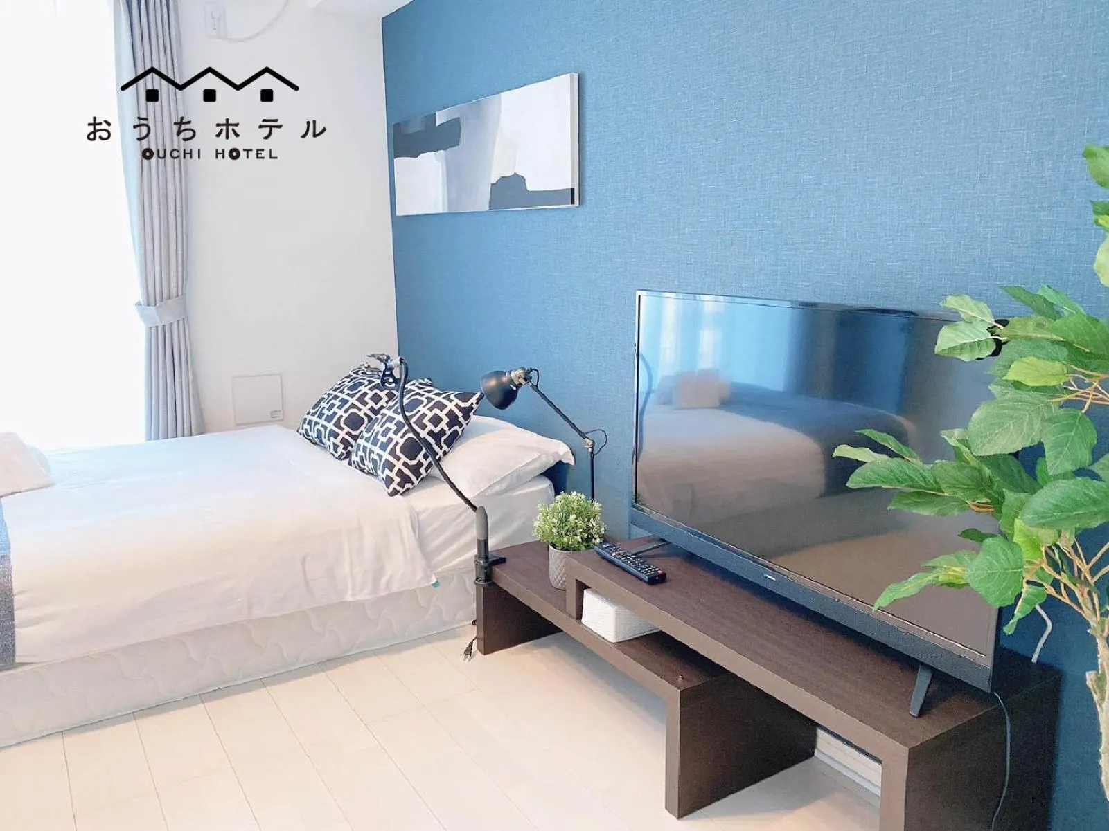 Bed in OUCHI HOTEL Hatsukaichi-Ekimae