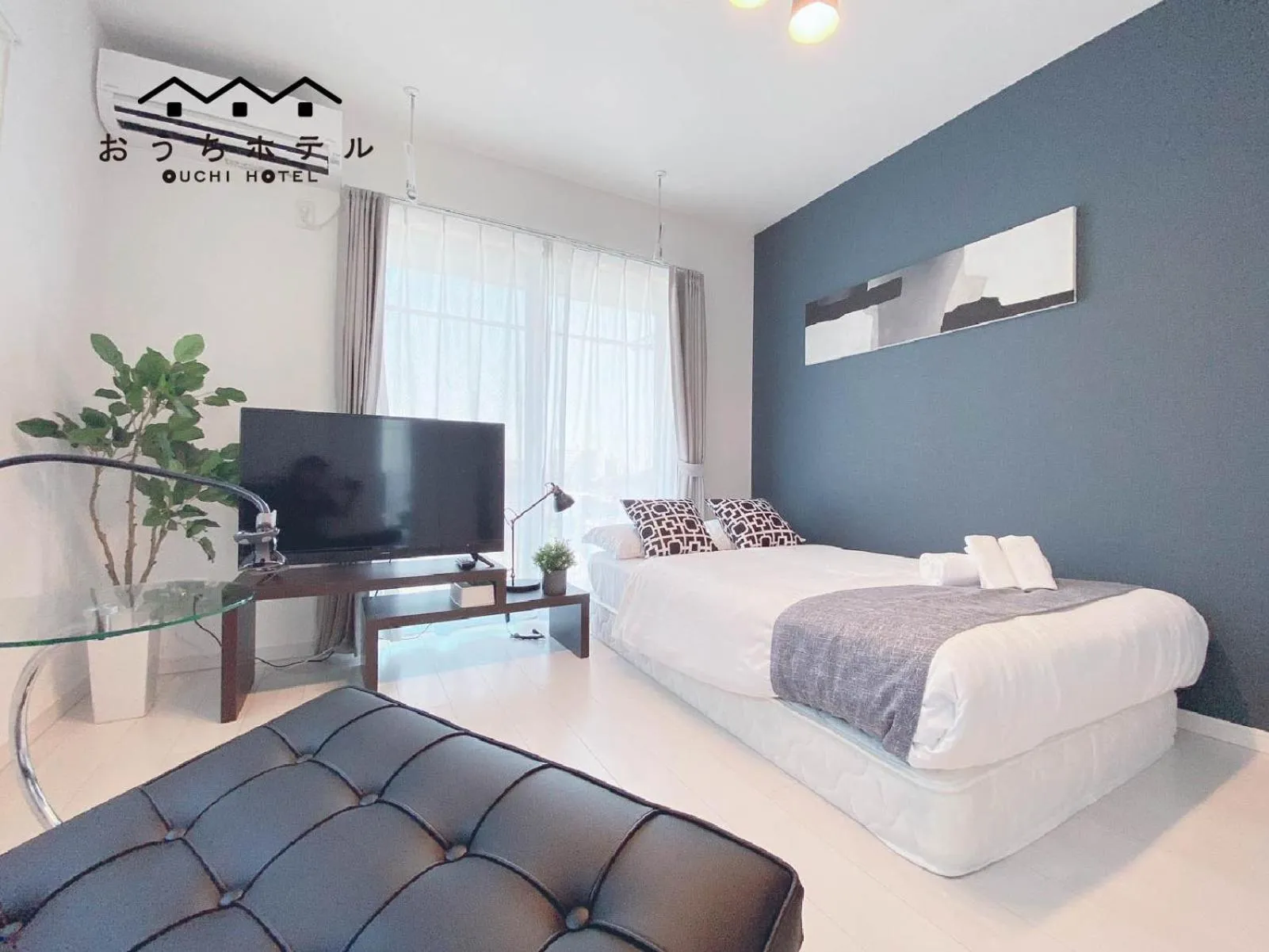 Bed in OUCHI HOTEL Hatsukaichi-Ekimae