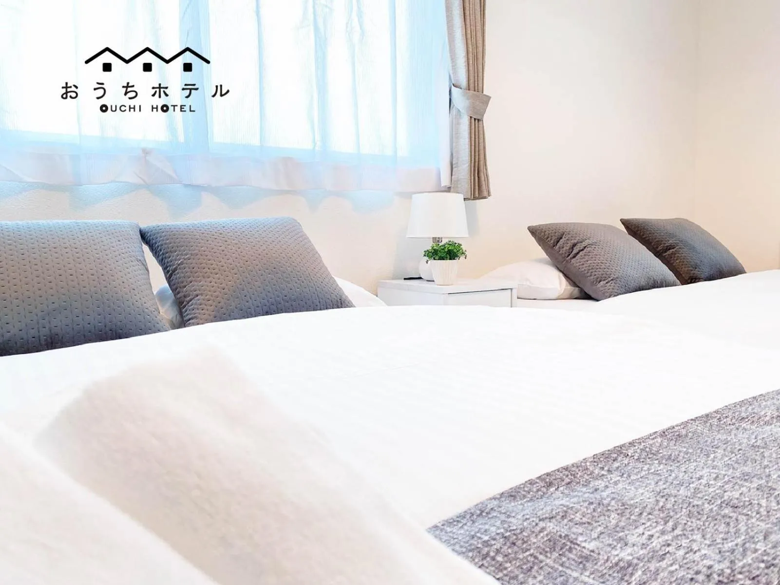 Bed in OUCHI HOTEL Miyajimaguchi