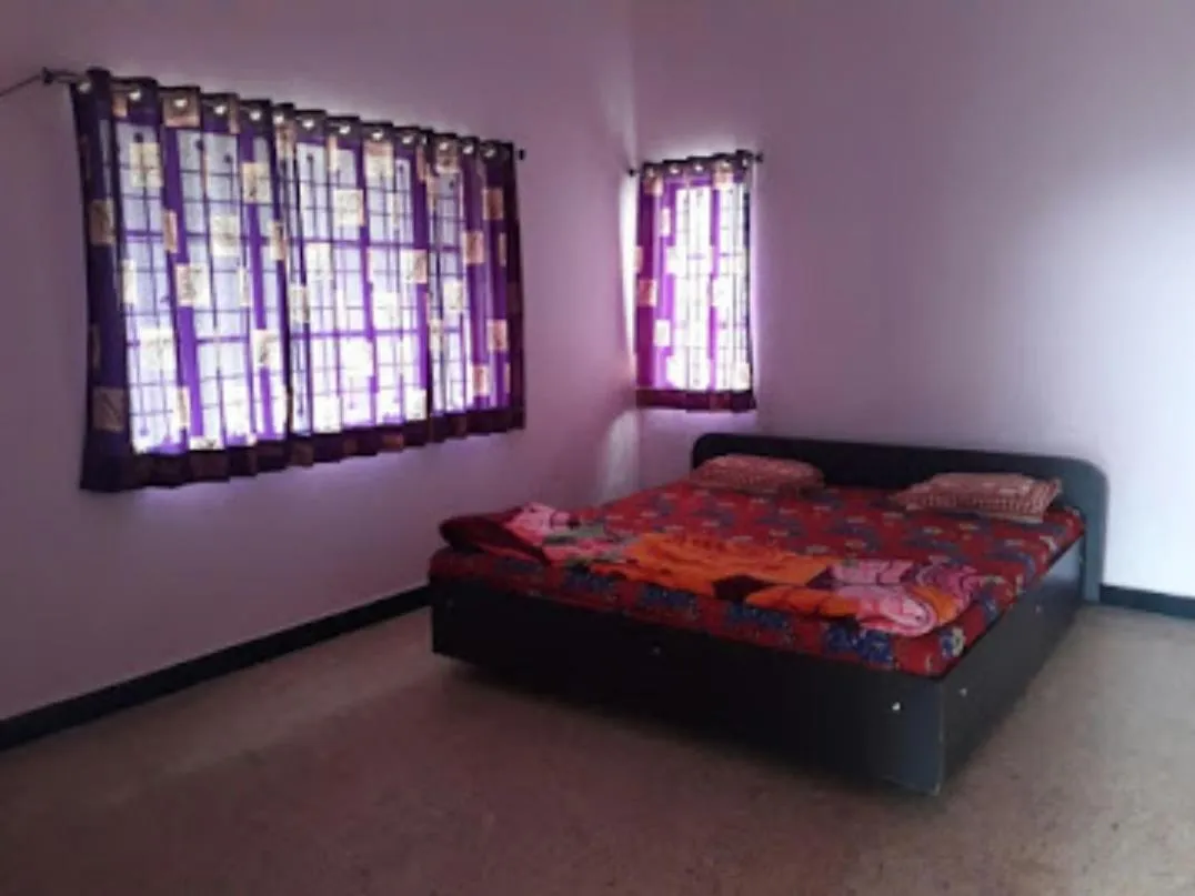 Bed in Vamoose Laxmi Hill Resort