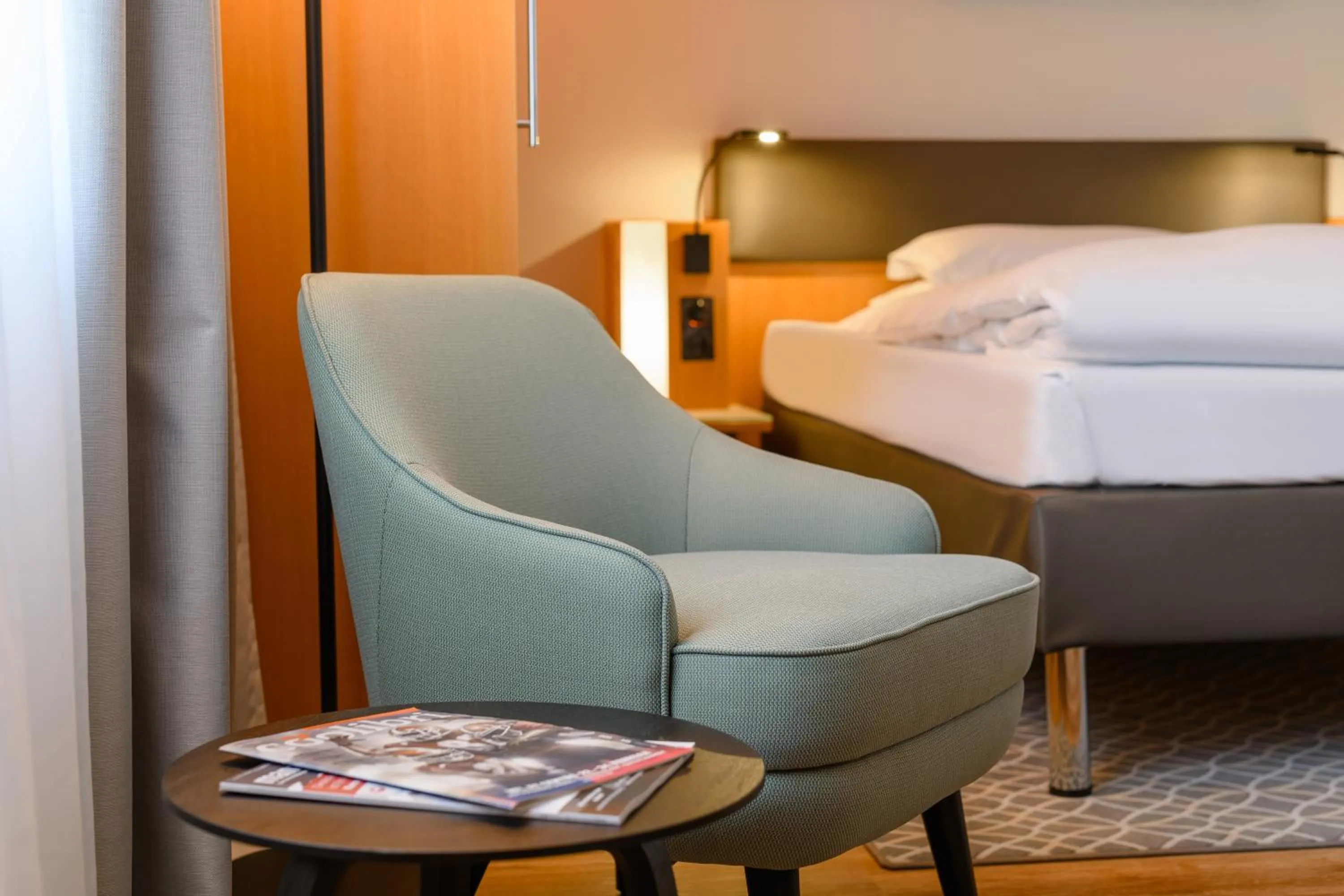 Seating area, Bed in Mercure Hotel Bochum City