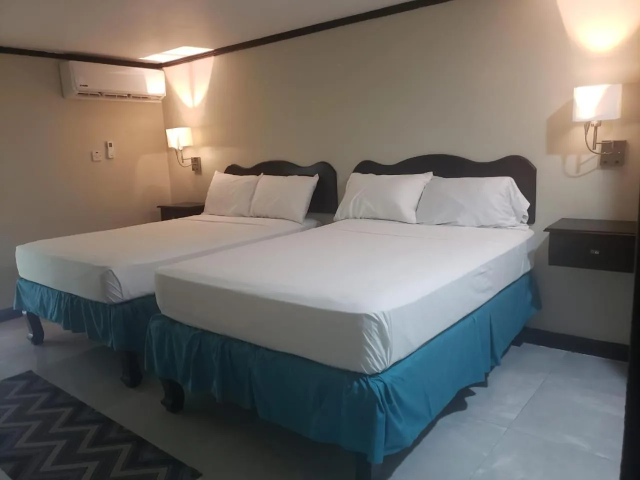 Photo of the whole room, Bed in Sand and Blue Seas