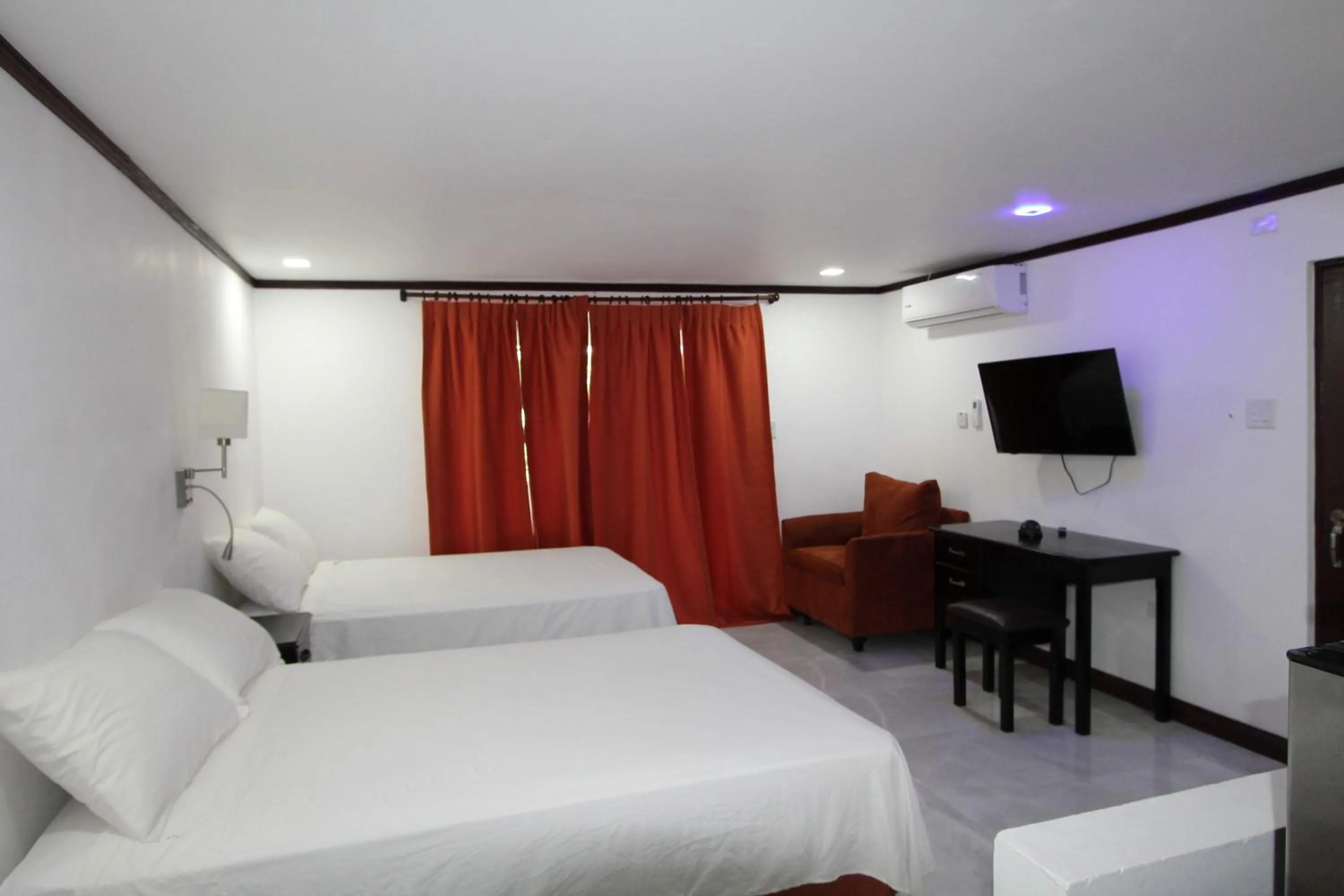 Photo of the whole room, Bed in Sand and Blue Seas