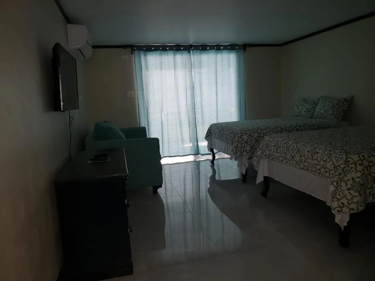 Bed in Sand and Blue Seas