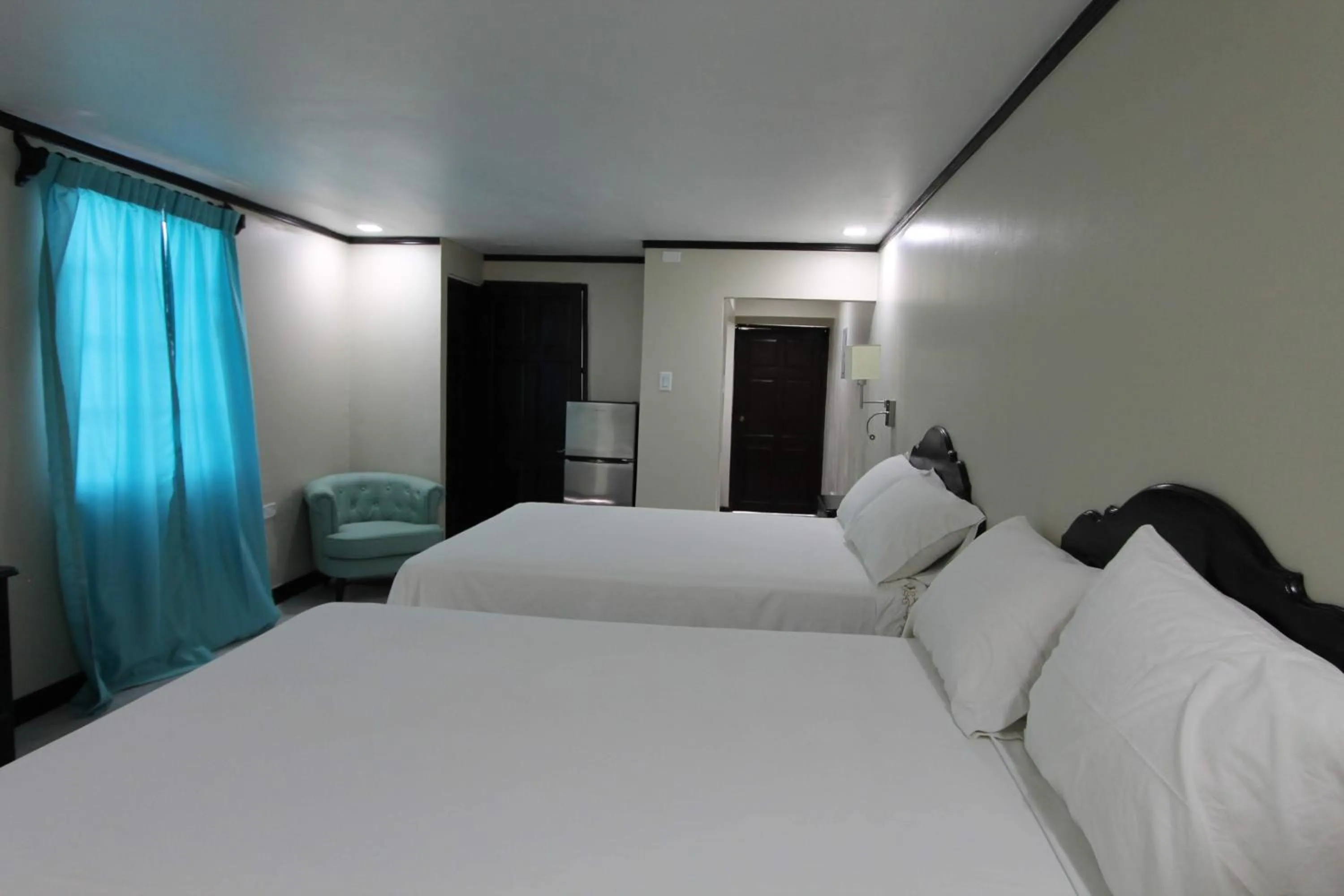 Bed in Sand and Blue Seas