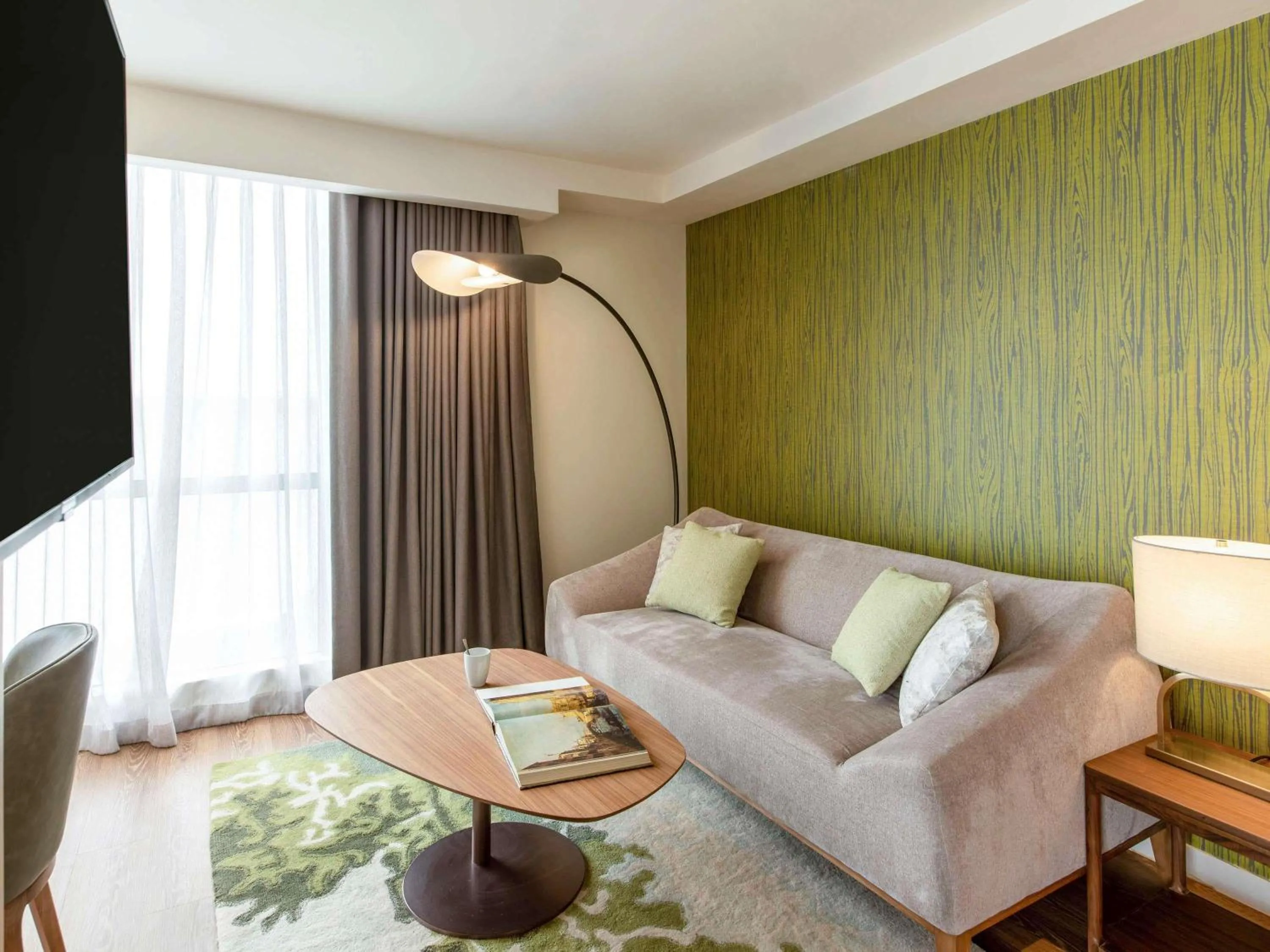 Bedroom in Novotel Suites Manila at Acqua