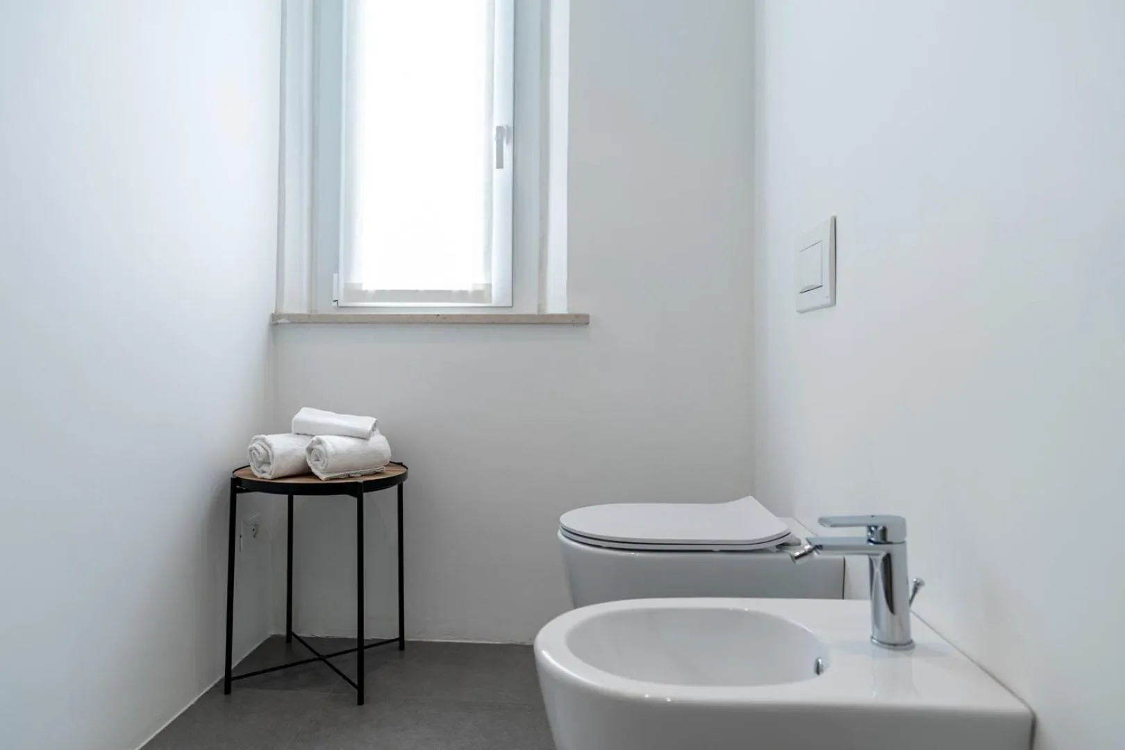 Toilet in Amare Suite & Apartments