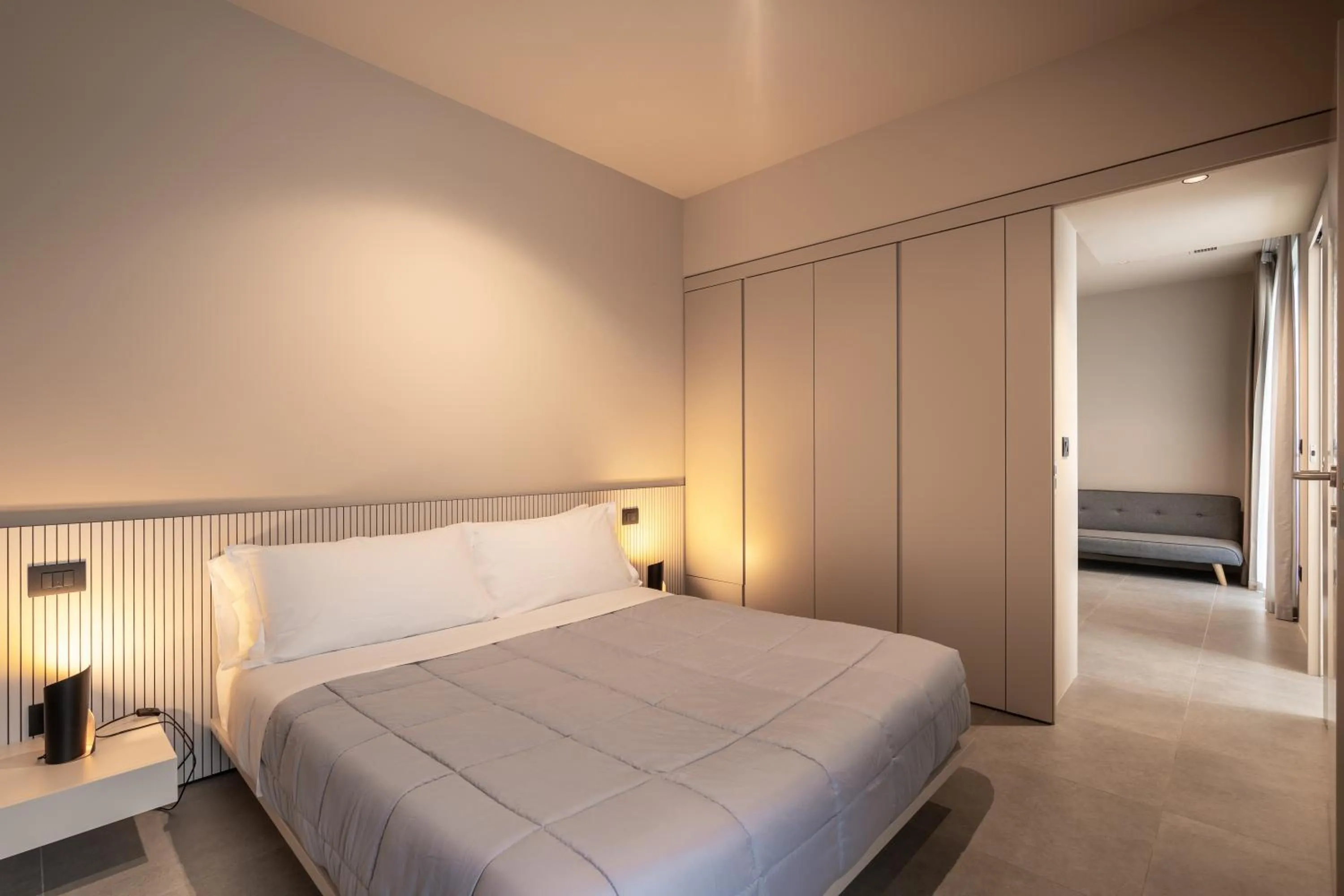 Bed in Amare Suite & Apartments