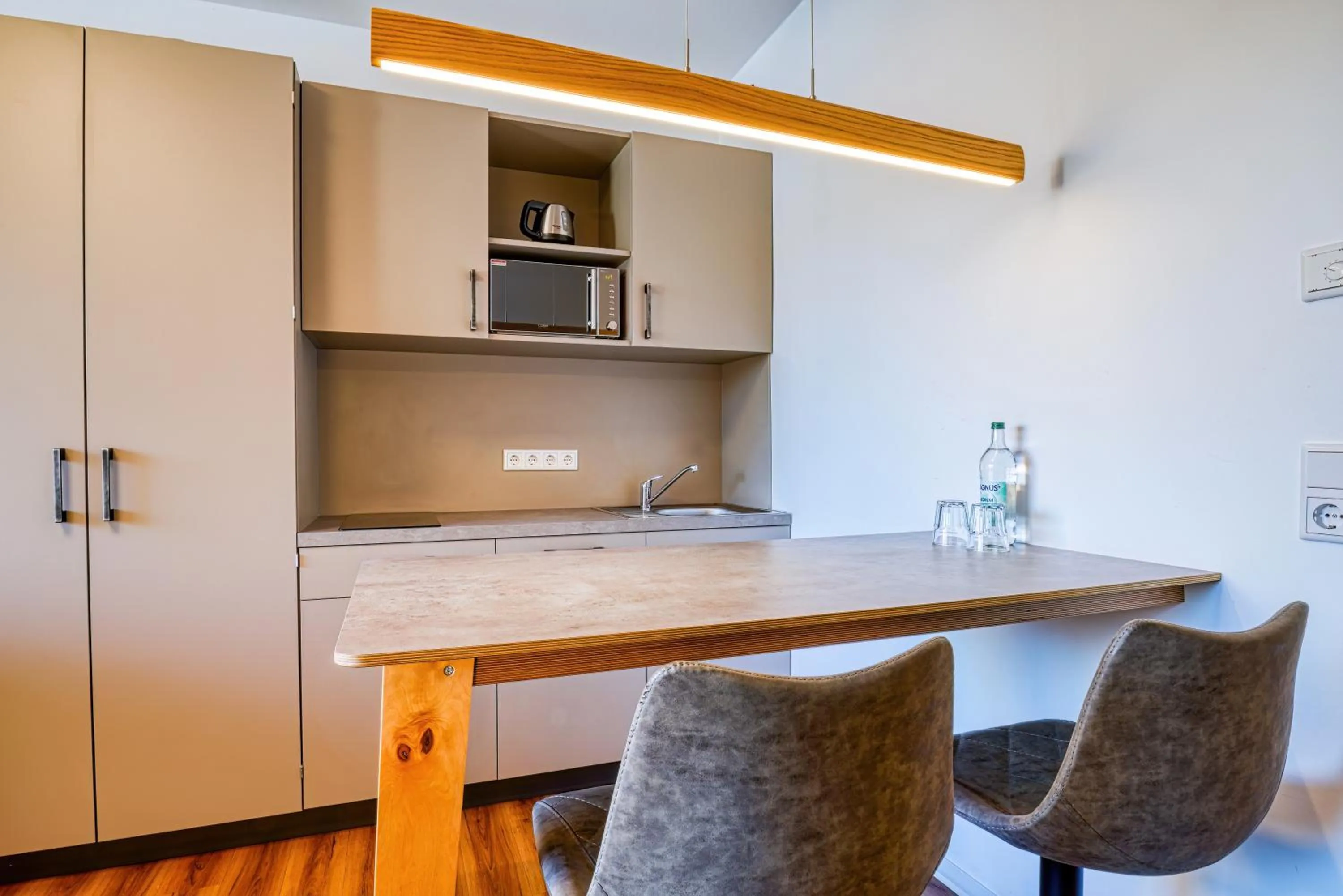 Kitchen or kitchenette in NiceToStay by Fairway Hotels