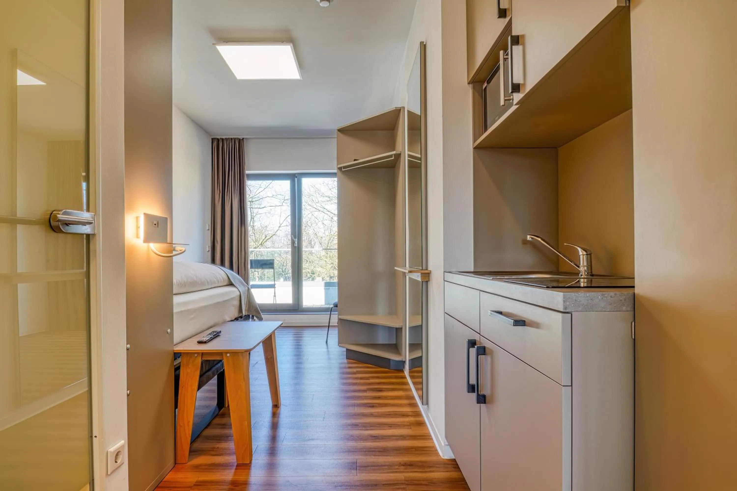 Kitchen or kitchenette in NiceToStay by Fairway Hotels