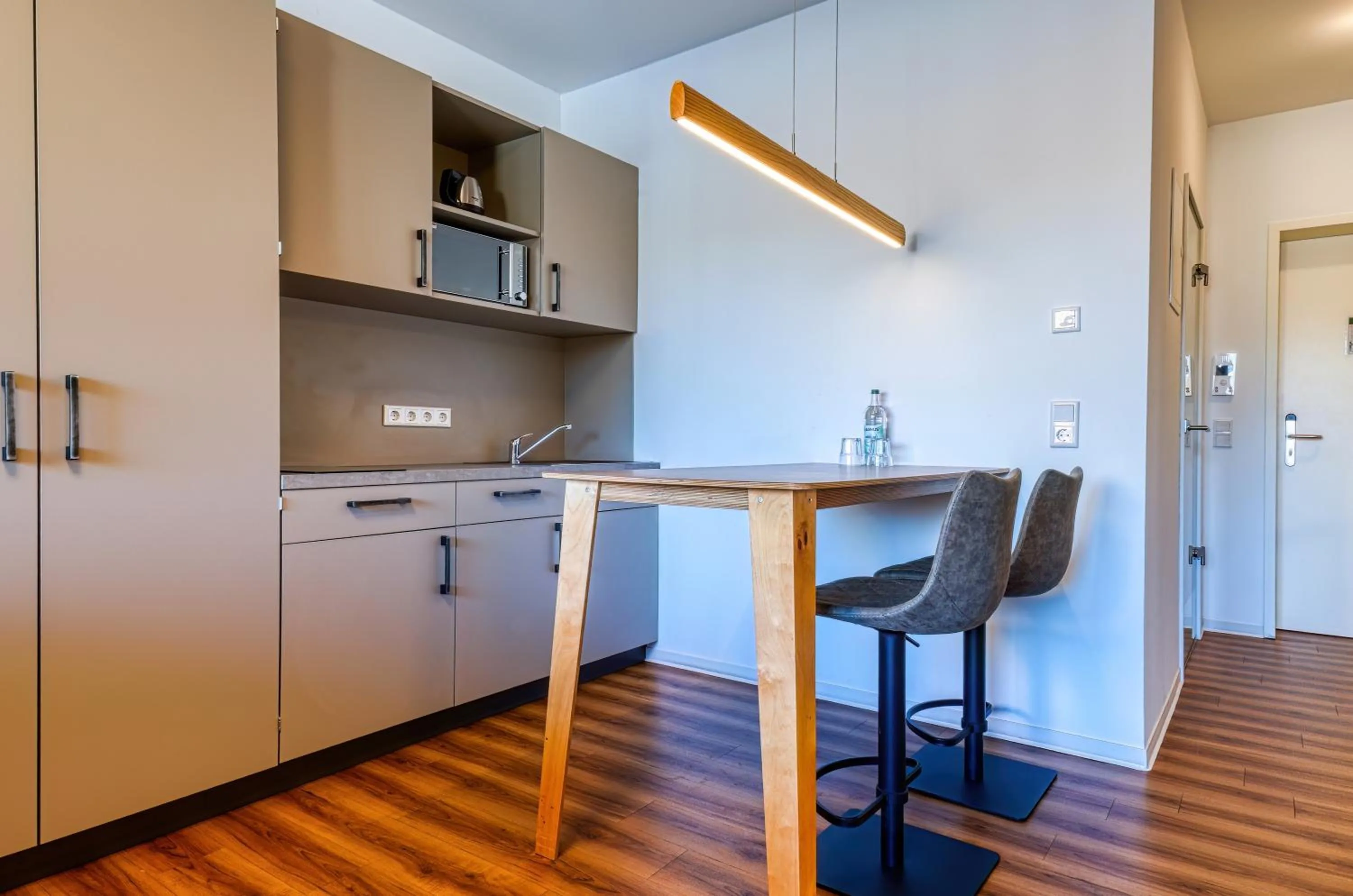 Kitchen or kitchenette in NiceToStay by Fairway Hotels