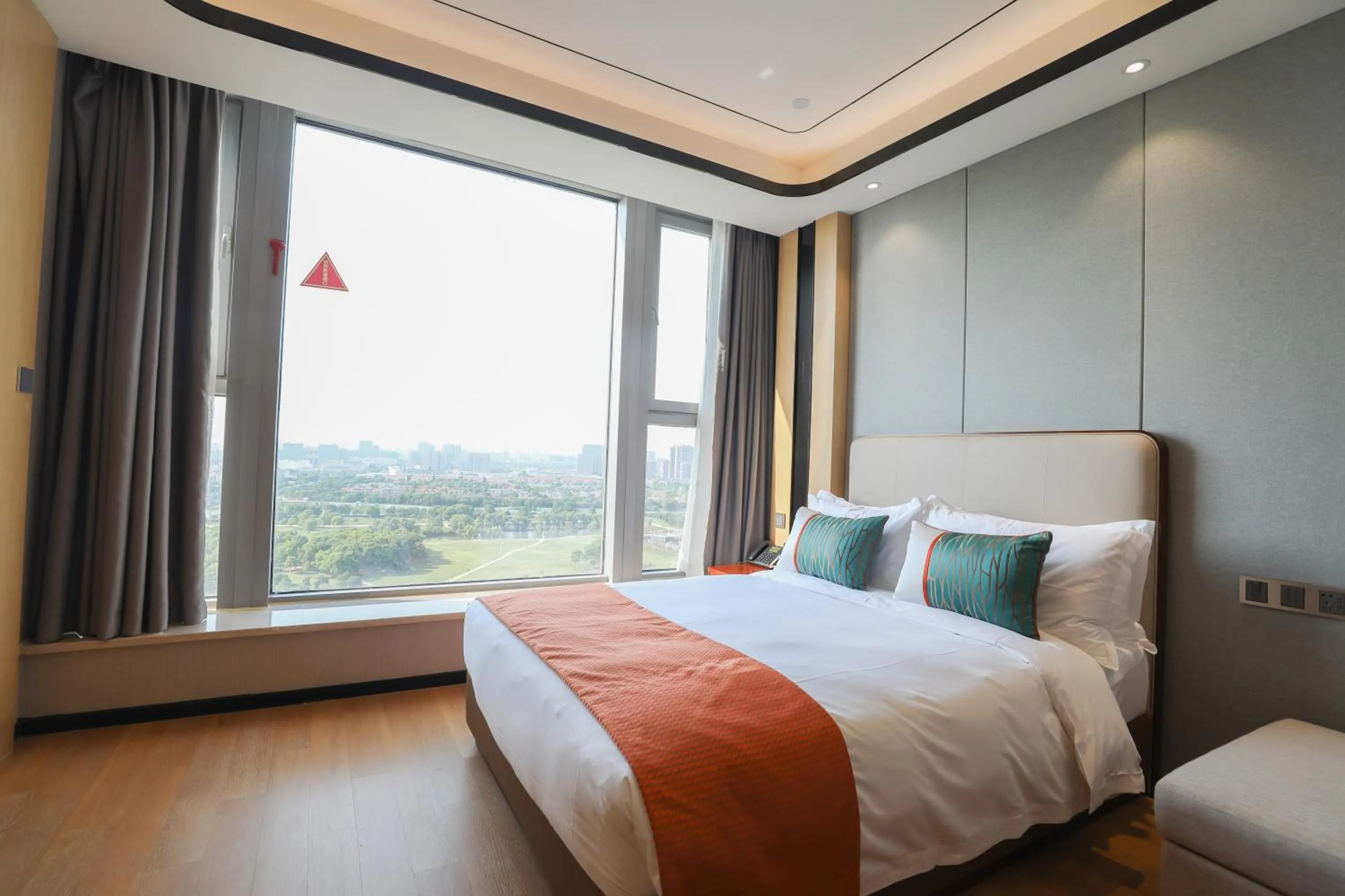 Bed in Jinling Funhome Hotel Nanjing Jiulong Lake - Nanjing South Railway Station