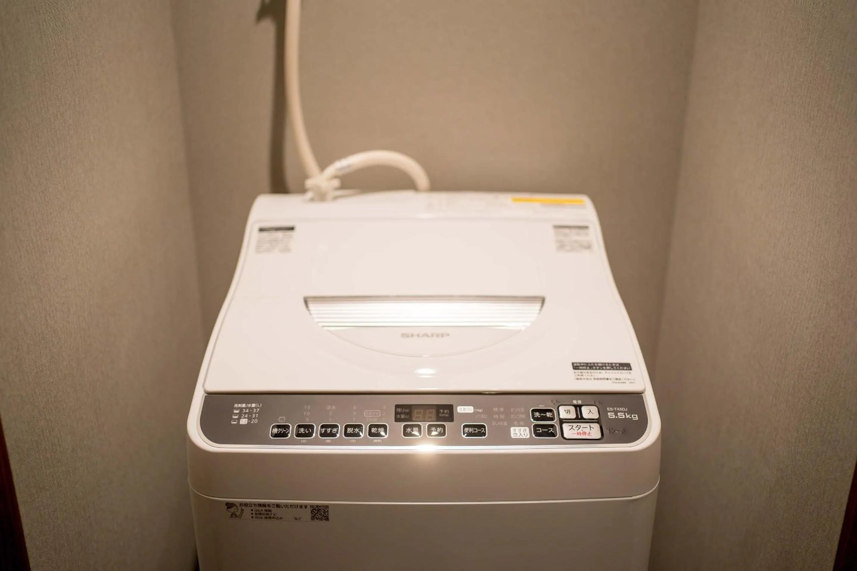 washing machine in RESI STAY Hotel Sun Chlorella