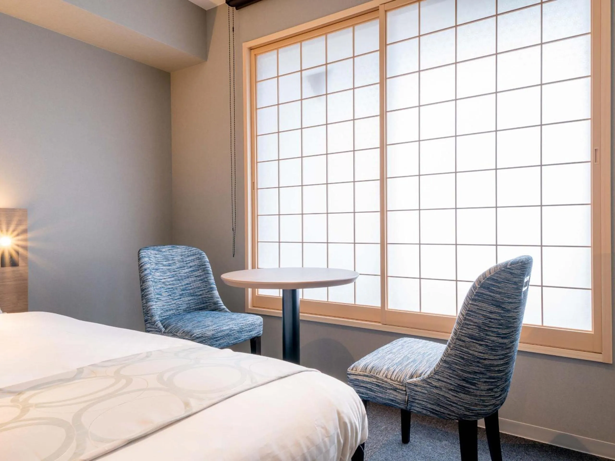 Seating area, Bed in RESI STAY Hotel Sun Chlorella