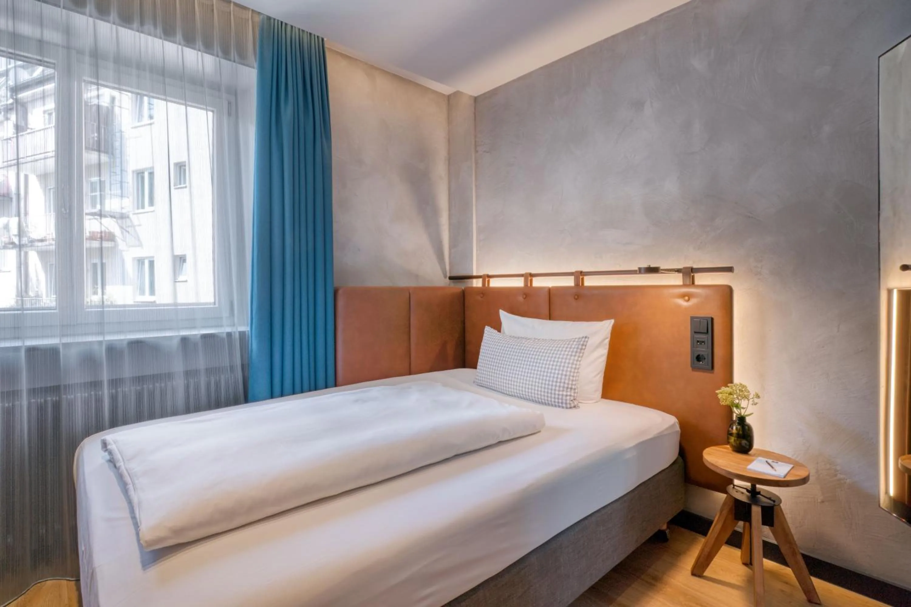 Photo of the whole room, Bed in Unsöld's Factory Hotel