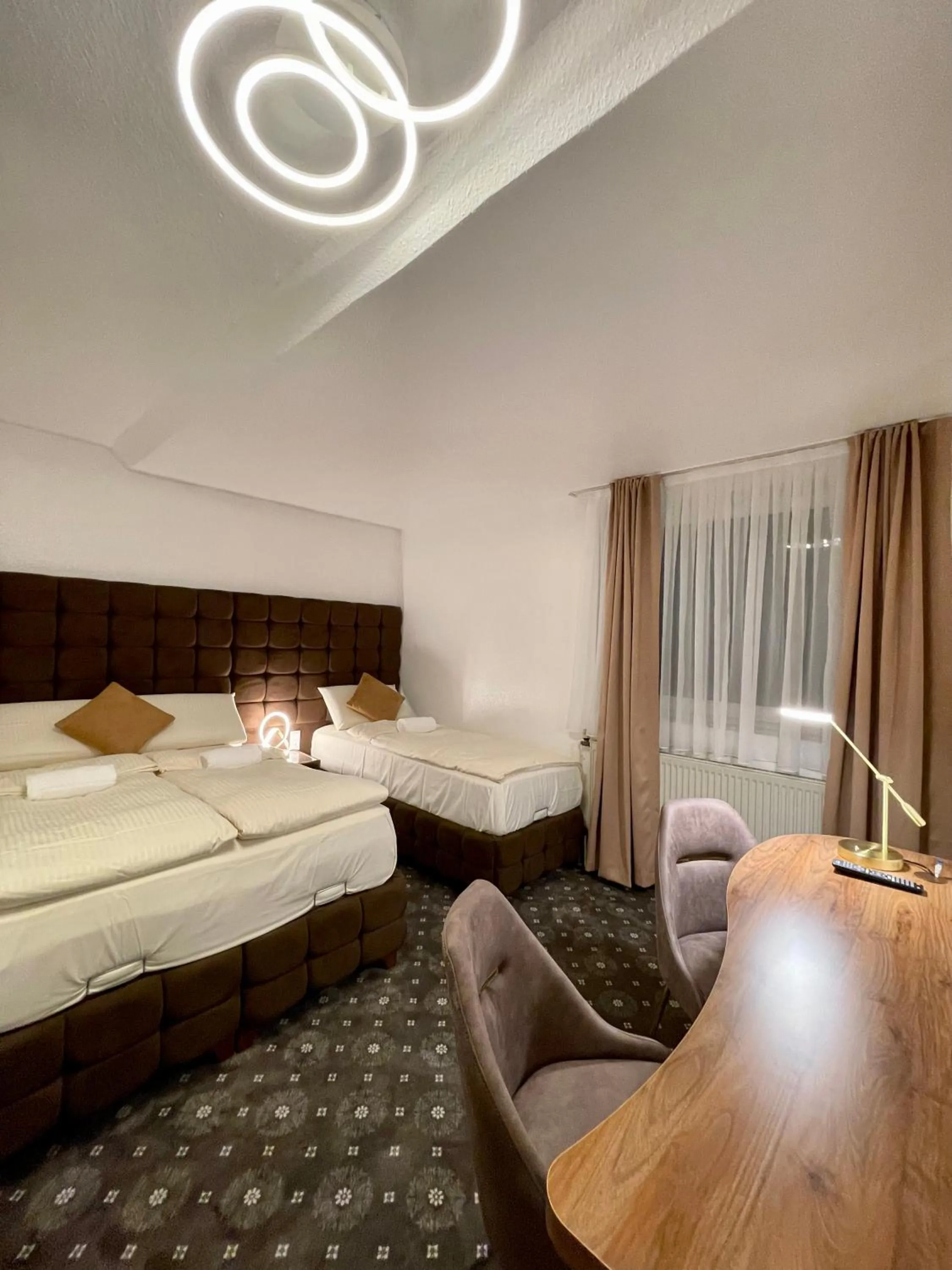 Photo of the whole room, Bed in Hotel Rüttenscheider Stern