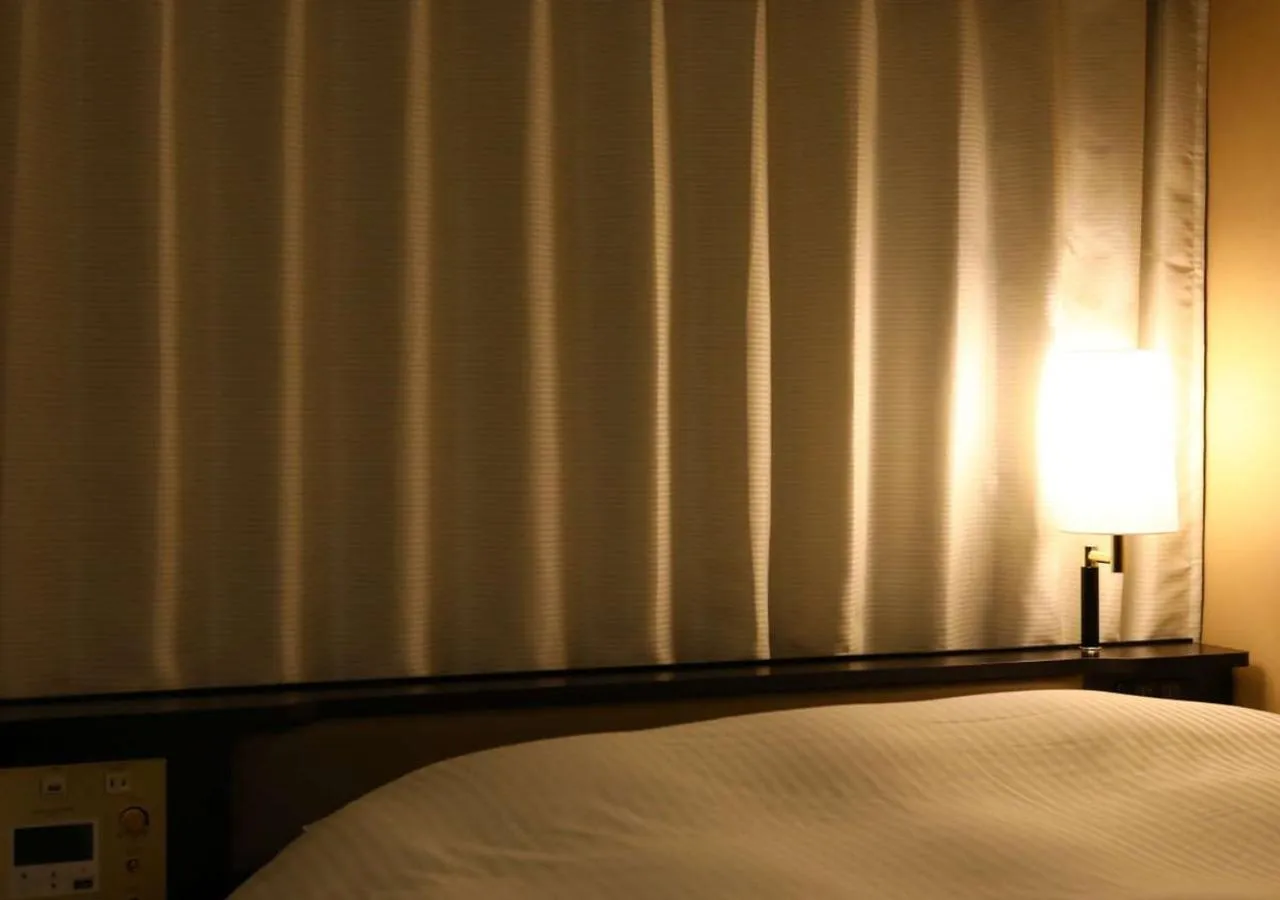 Photo of the whole room, Bed in APA Hotel Higashi Shinjuku Kabukicho Tower