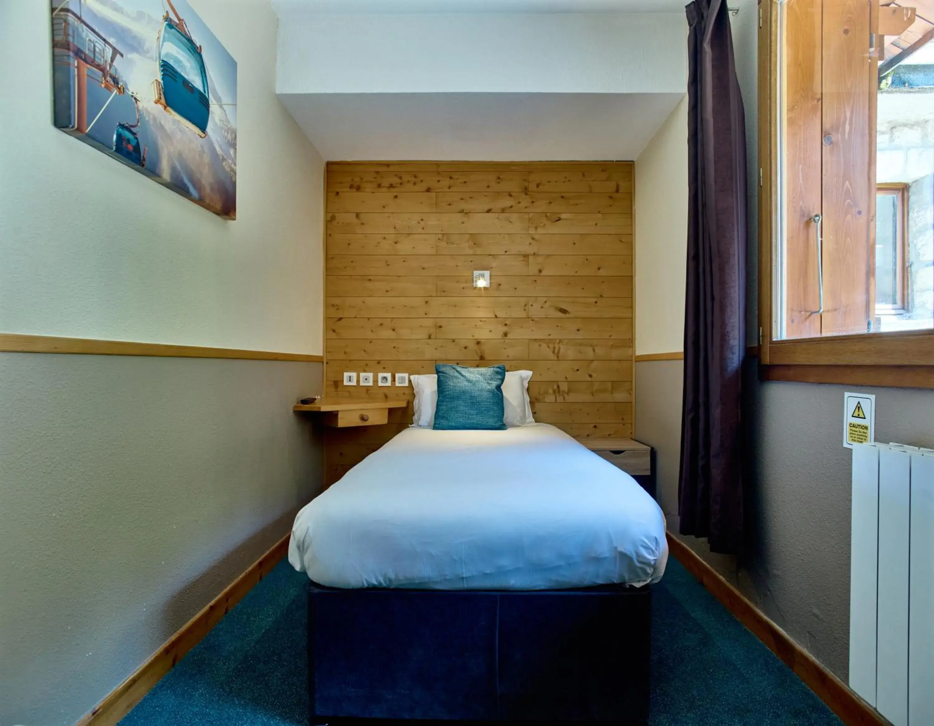 Bed in Hôtel Les Grangettes Bed in Hôtel Les Grangettes