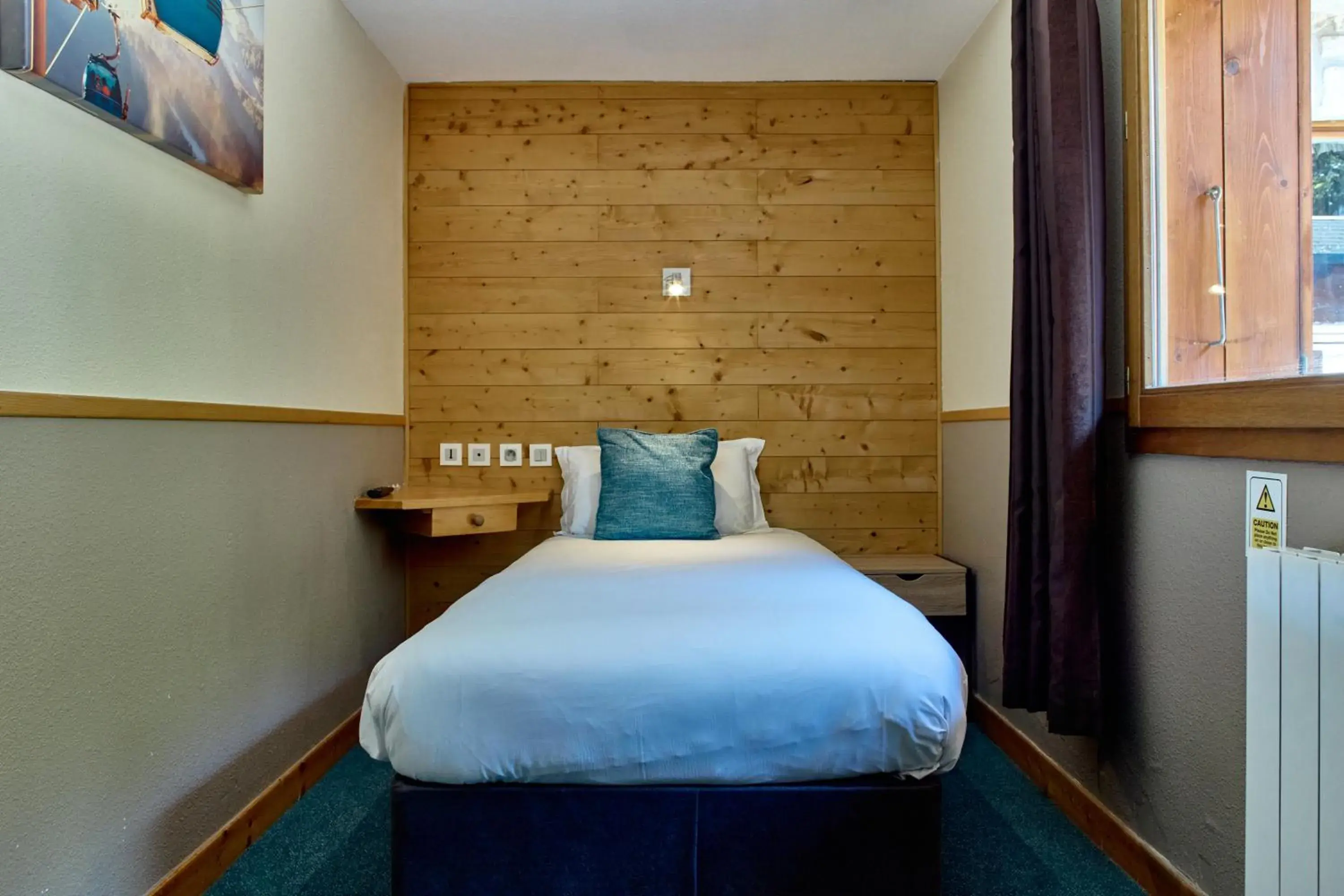 Bed in Hôtel Les Grangettes Bed in Hôtel Les Grangettes