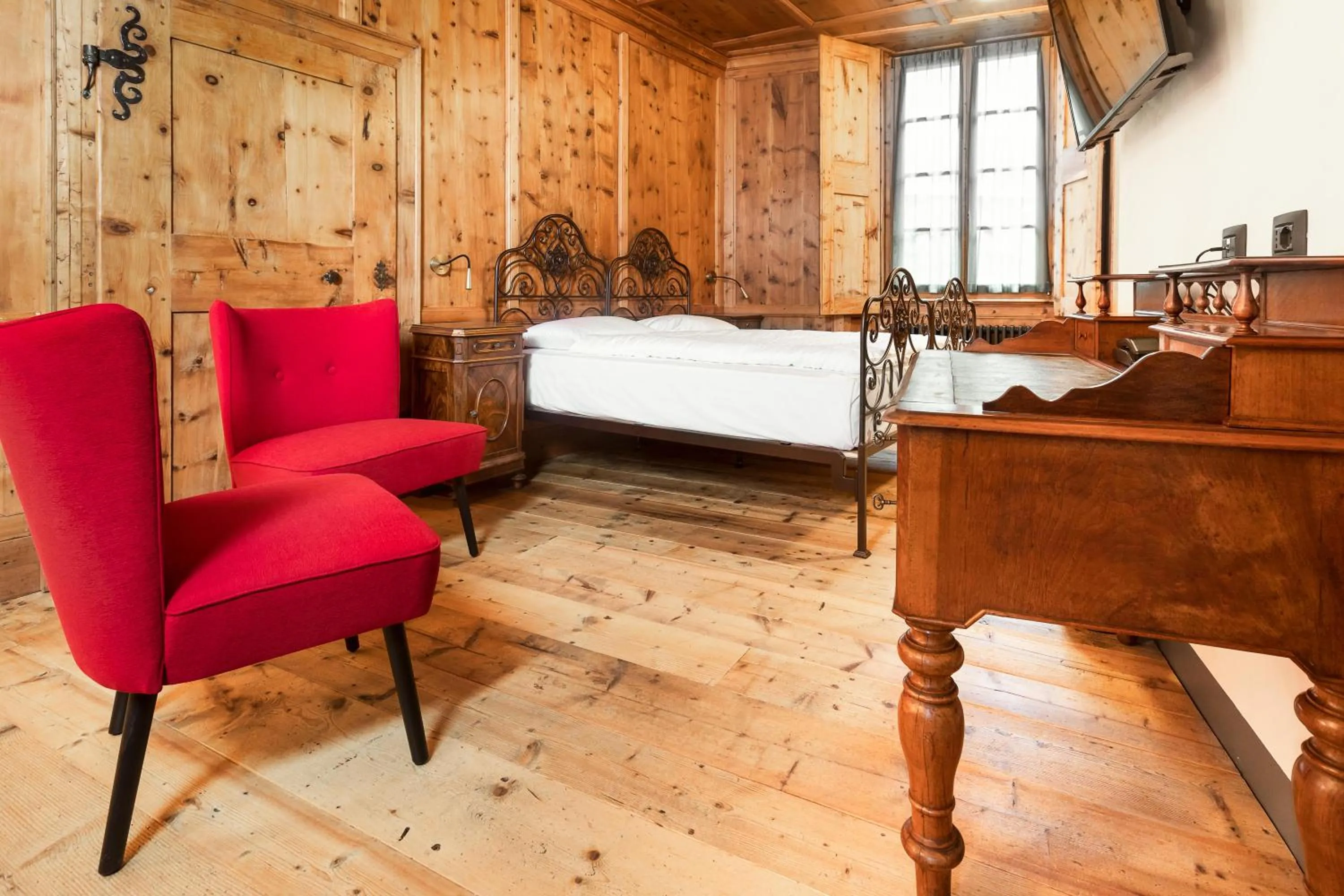 Photo of the whole room in Curt di Clement Eco Mobility Hotel