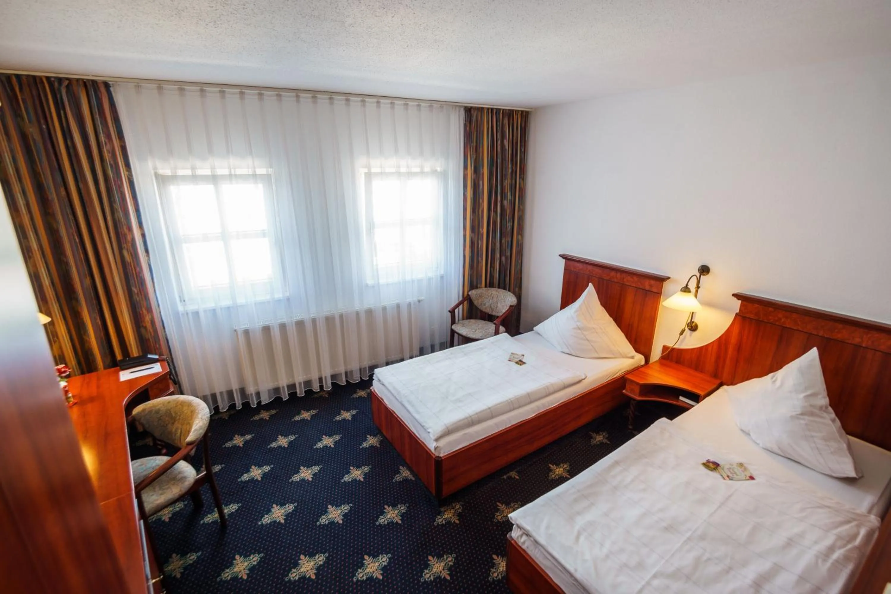 Photo of the whole room, Bed in Hotel Wilder Mann Annaberg-Buchholz