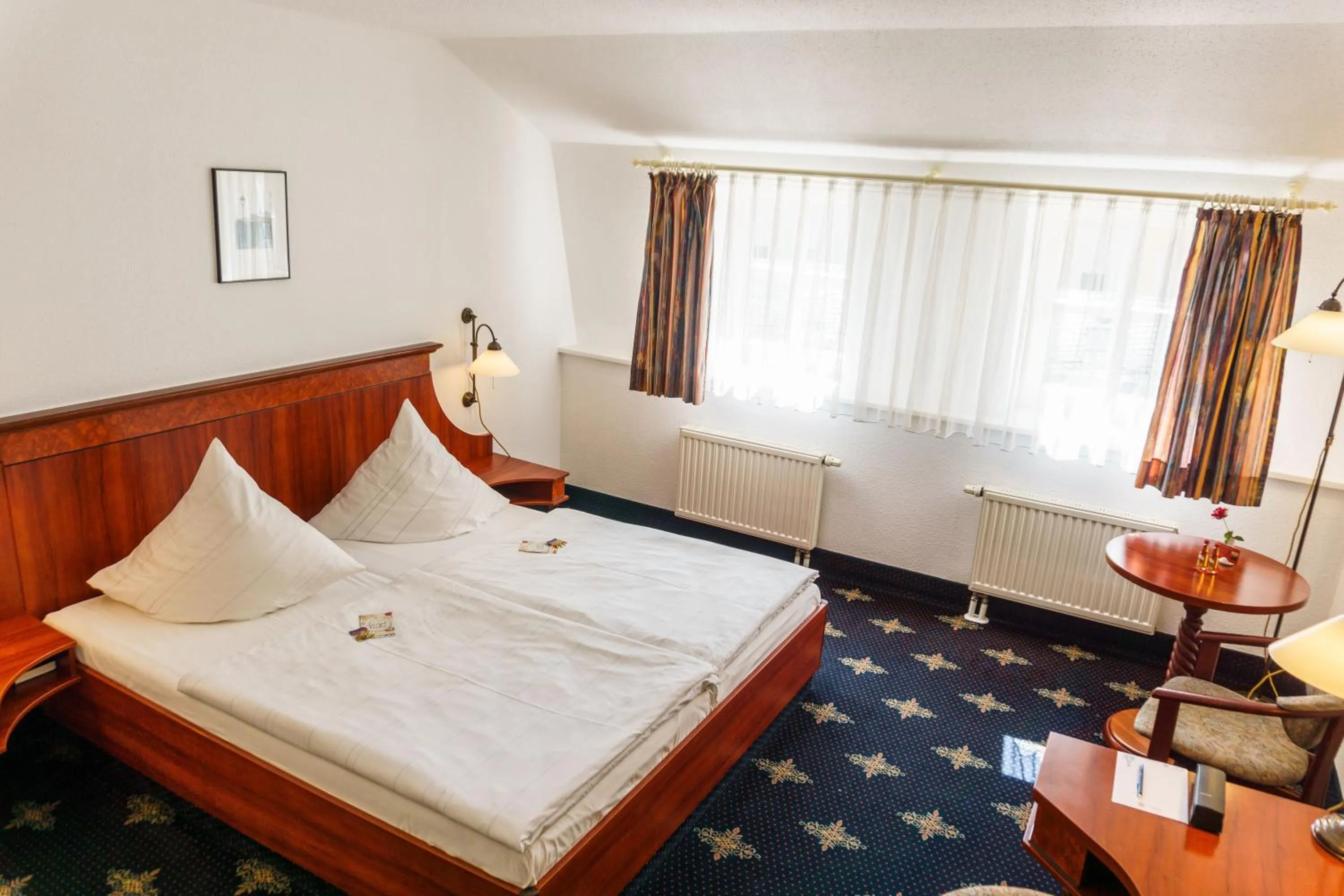 Photo of the whole room, Bed in Hotel Wilder Mann Annaberg-Buchholz