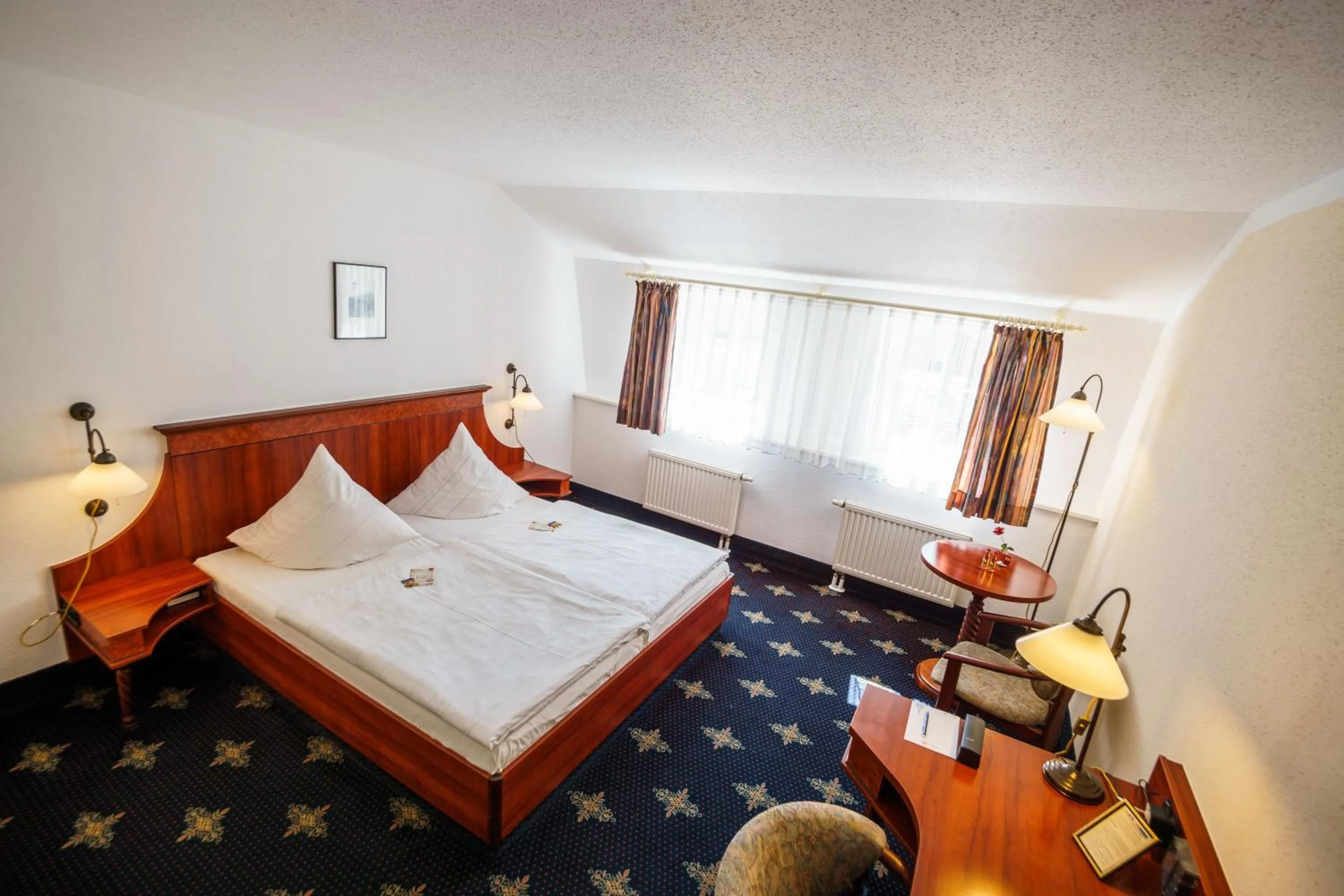 Photo of the whole room, Bed in Hotel Wilder Mann Annaberg-Buchholz