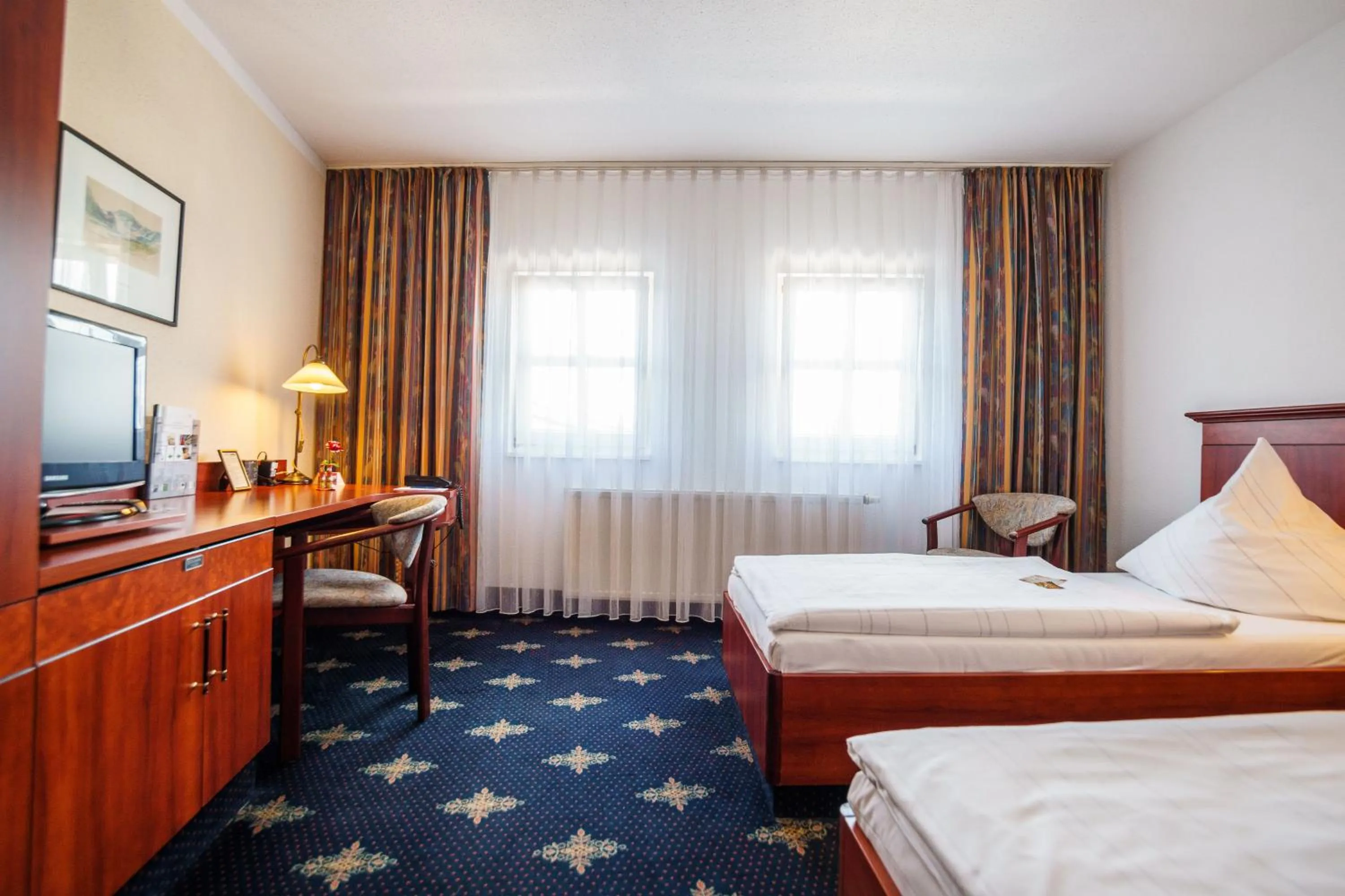 Photo of the whole room, Bed in Hotel Wilder Mann Annaberg-Buchholz