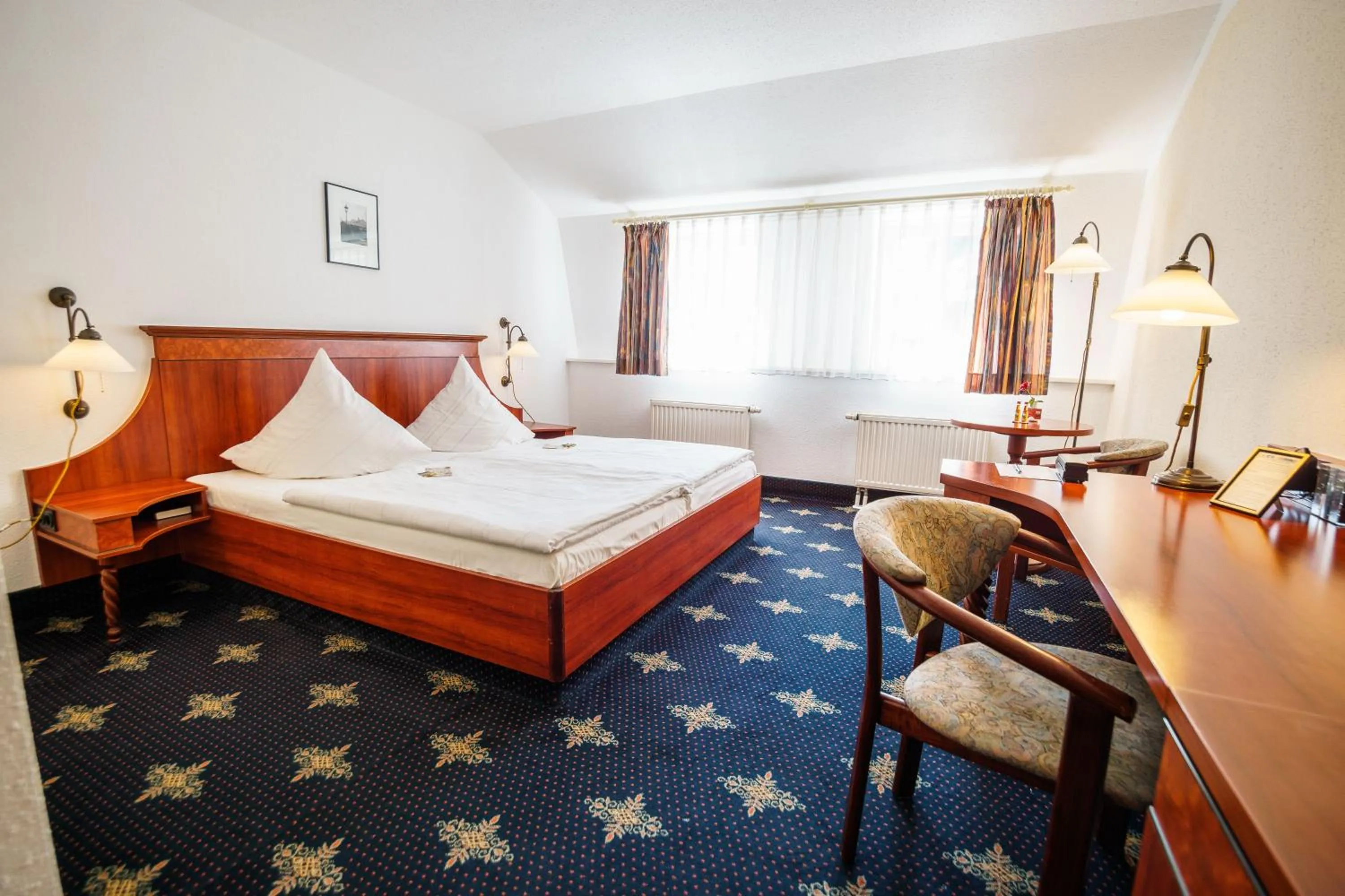 Photo of the whole room, Bed in Hotel Wilder Mann Annaberg-Buchholz