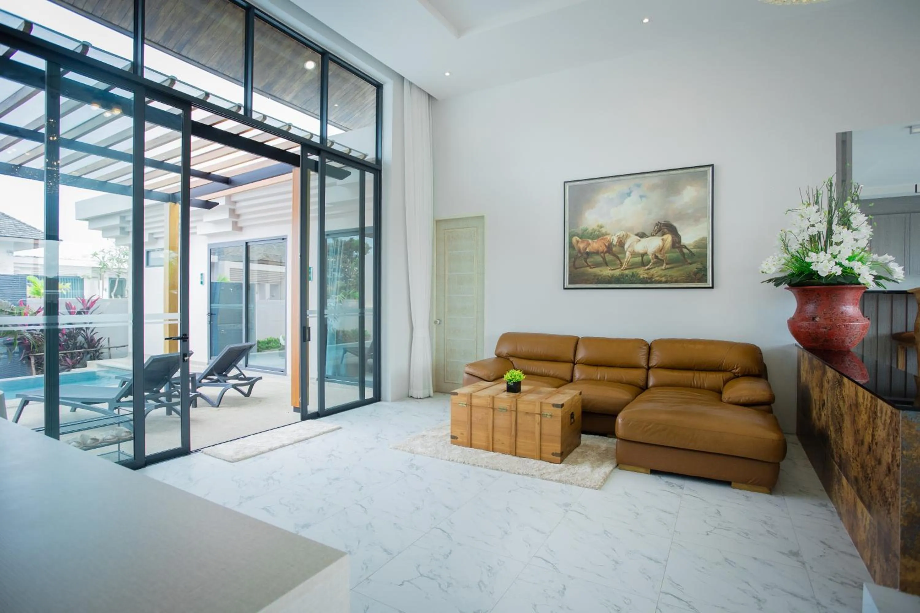 Living room in Gold Chariot Pool Villa, Phuket - SHA Plus Certified