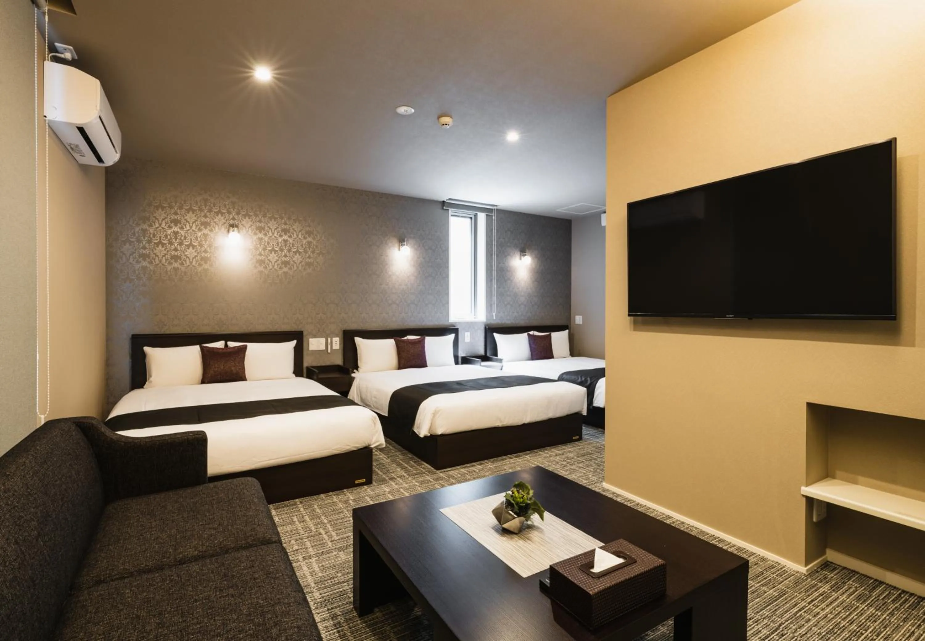 Bed in GRAND BASE Yakuin Odori