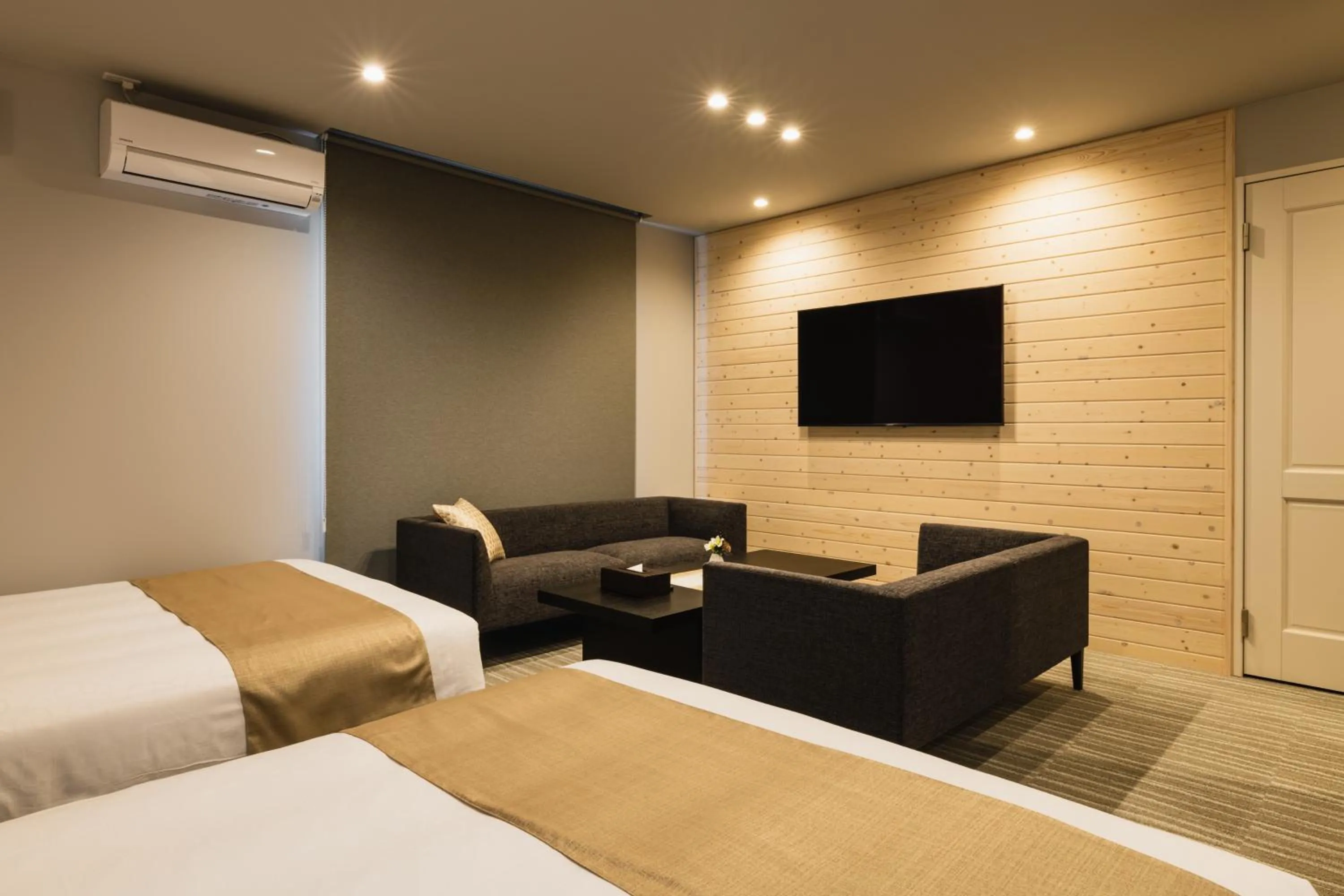 Seating area, Bed in GRAND BASE Yakuin Odori