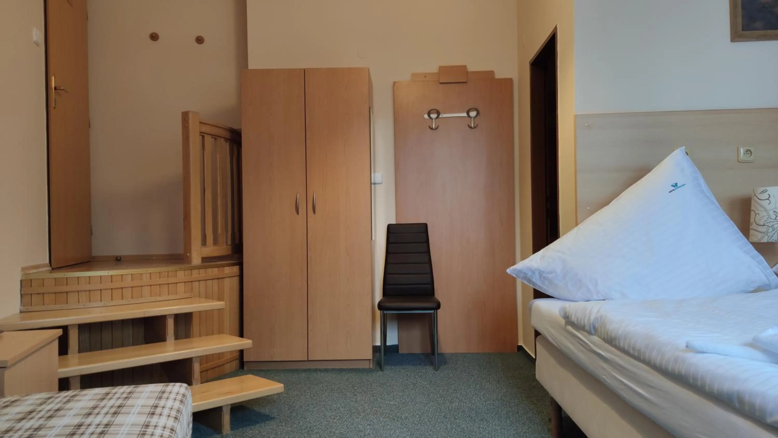 Bed in Hotel Modrásek