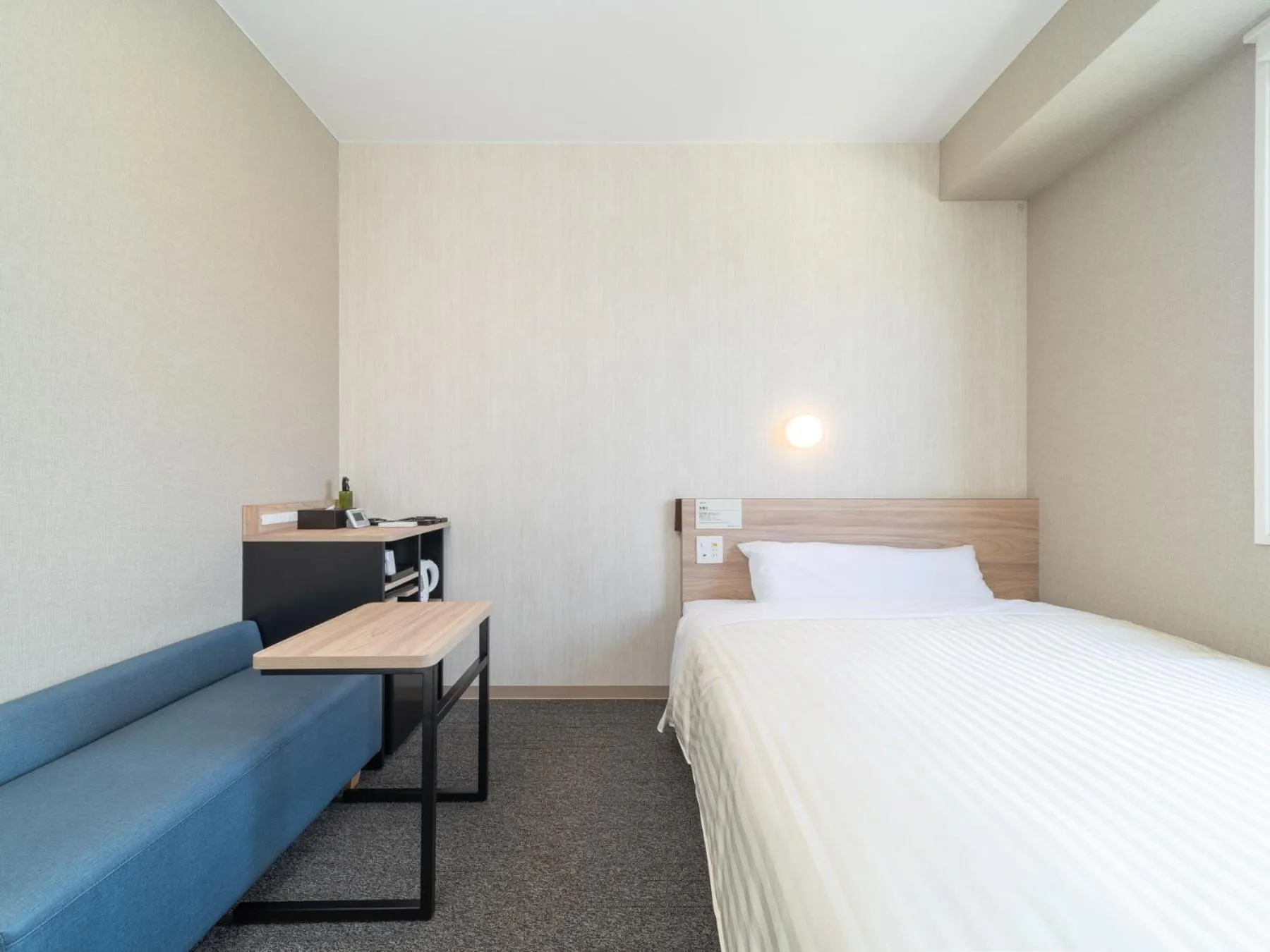 Bed in Super Hotel Iyo Saijo