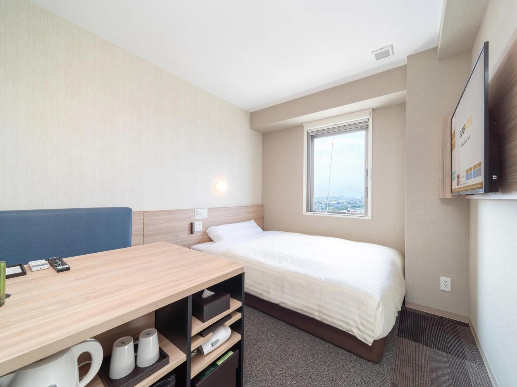 Bed in Super Hotel Iyo Saijo