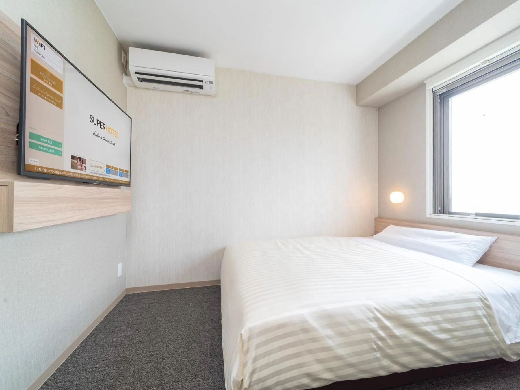 Bed in Super Hotel Iyo Saijo