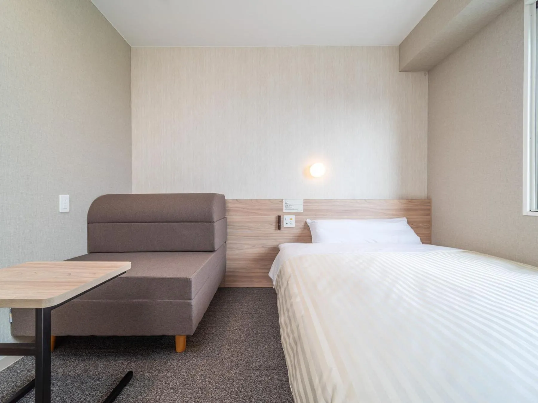 Bed in Super Hotel Iyo Saijo