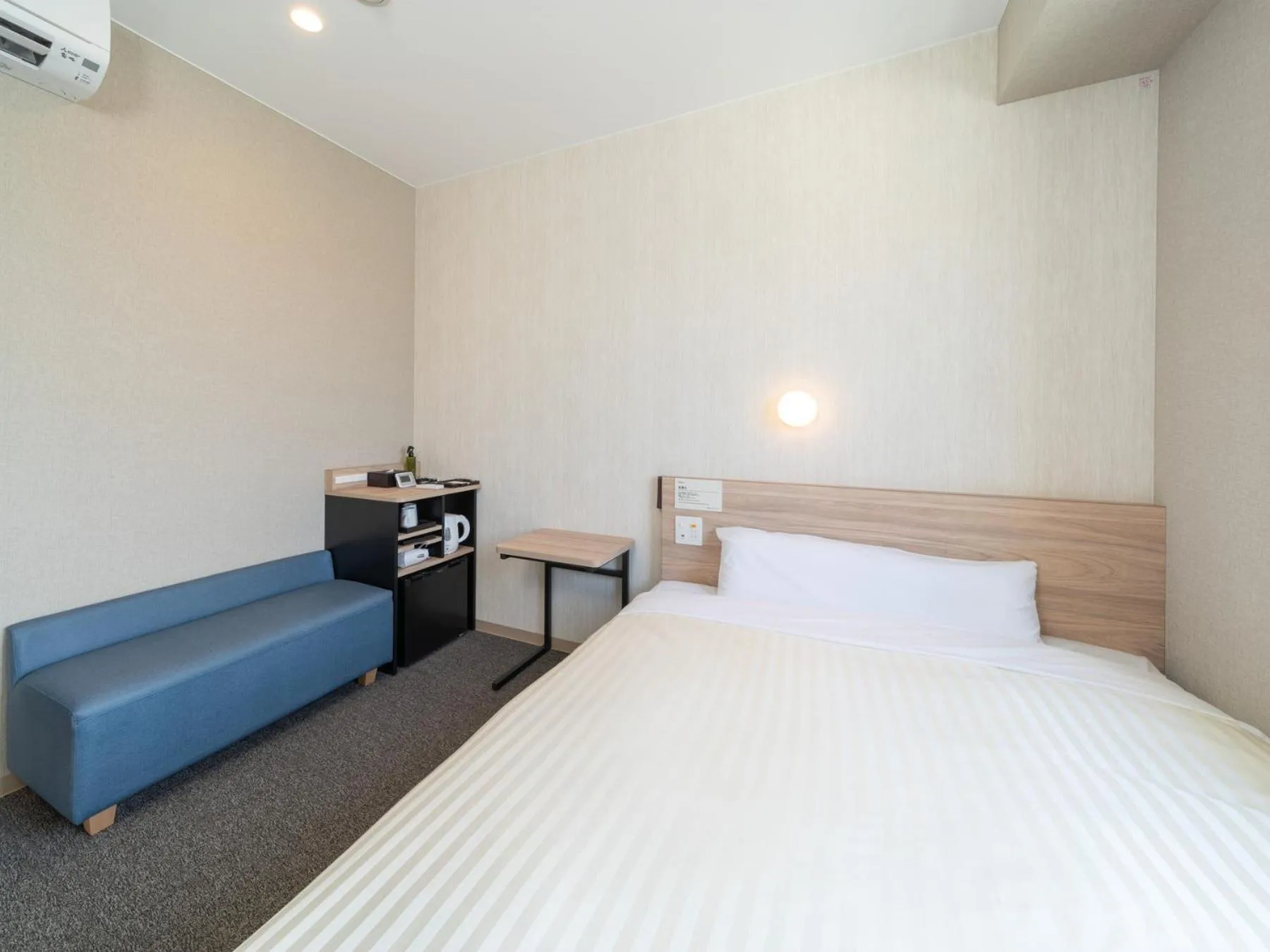 Bed in Super Hotel Iyo Saijo