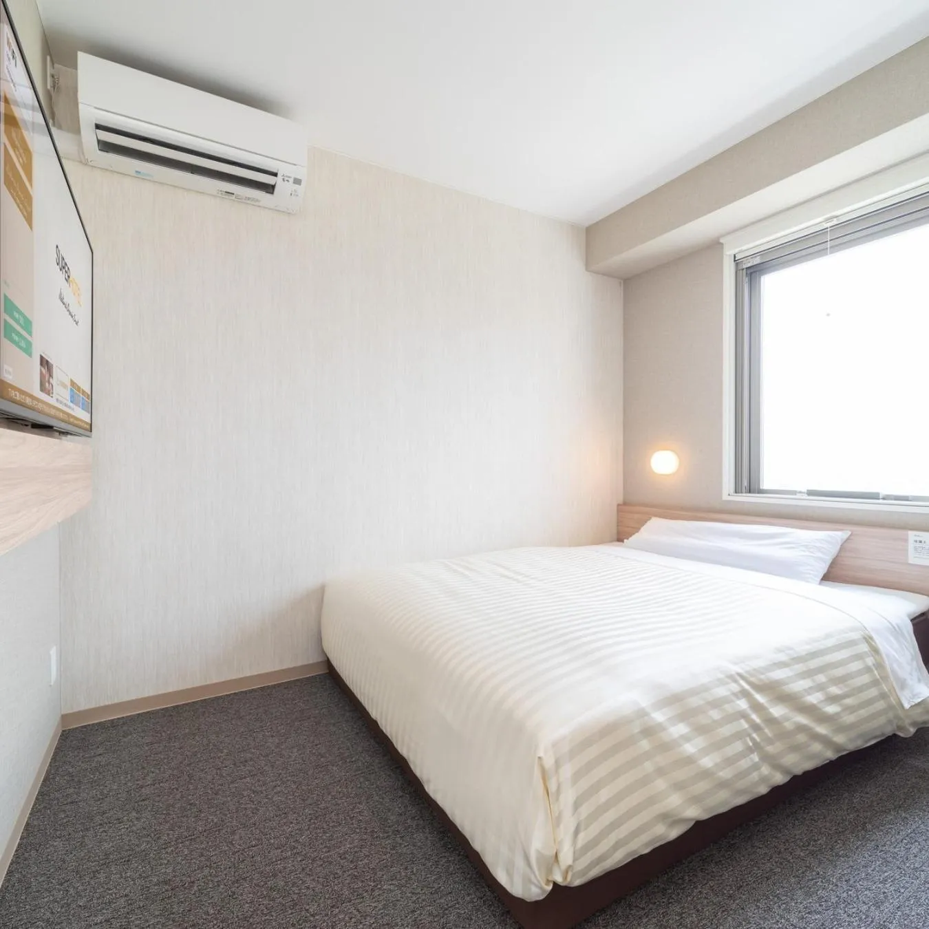 Bed in Super Hotel Iyo Saijo