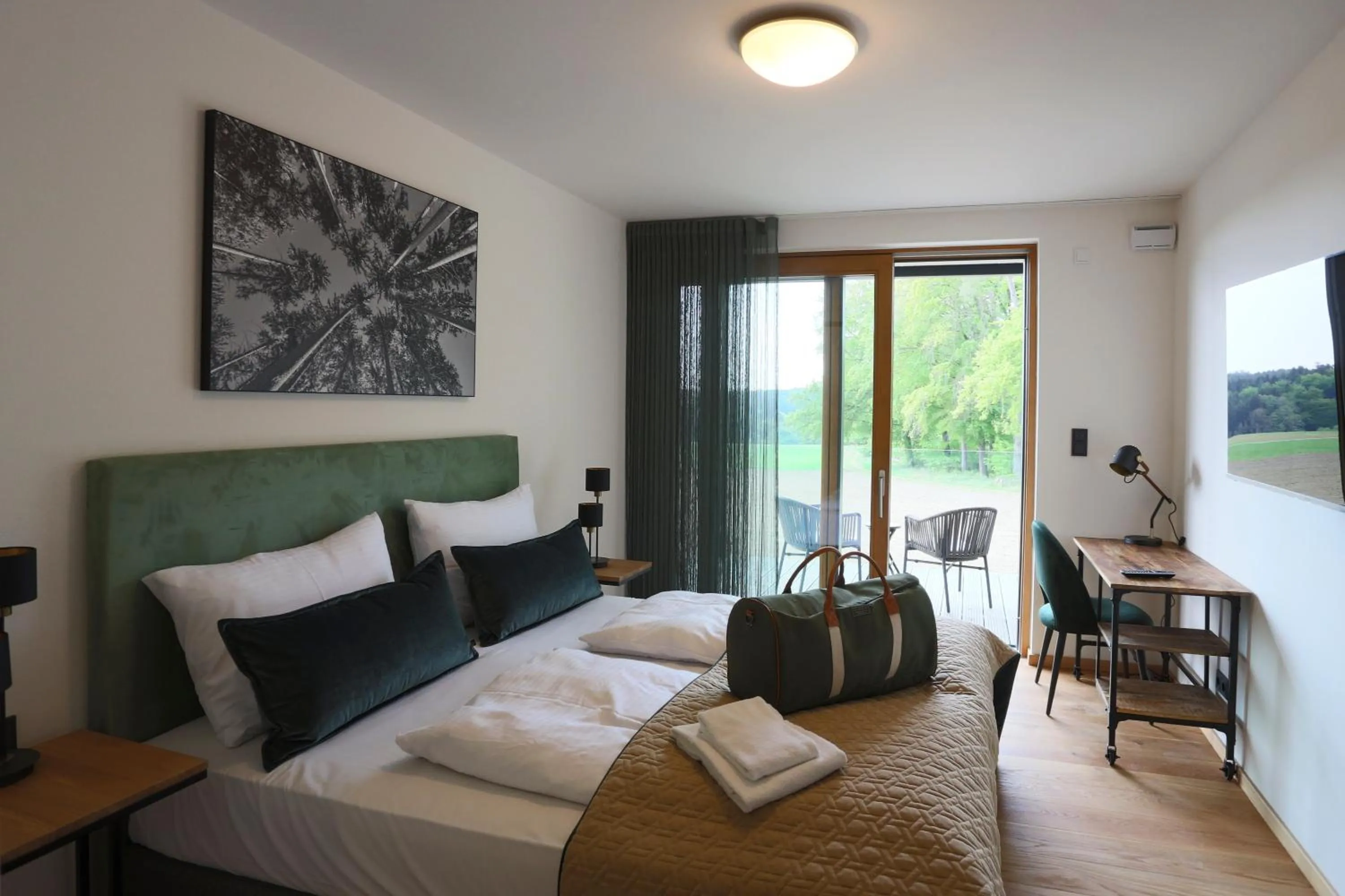 Seating area, Bed in Naturhotel Wittelsbach