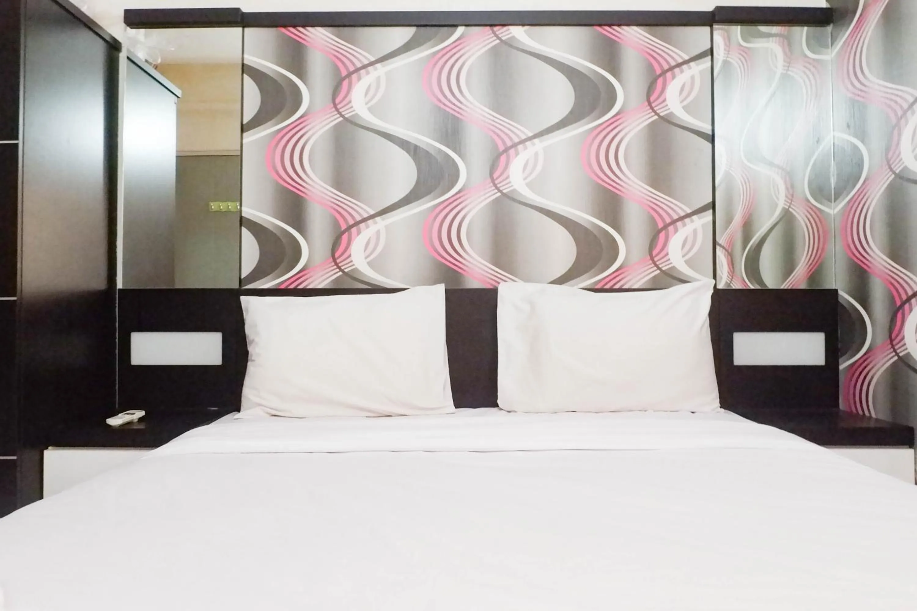 Bed in Minimalist 2BR Apartment at Dian Regency By Travelio