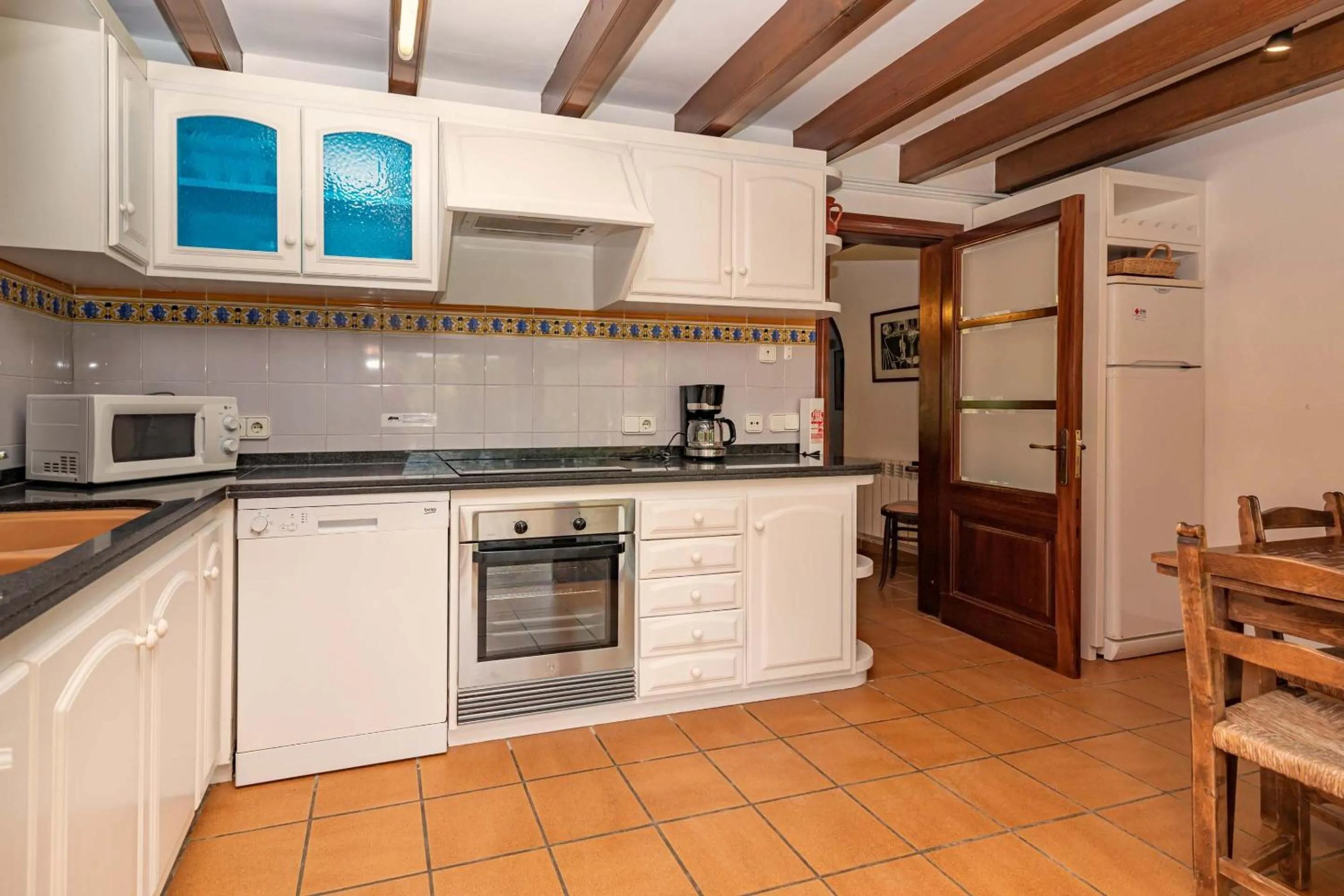 Kitchen or kitchenette in Villa Colonya by Sealand Villas