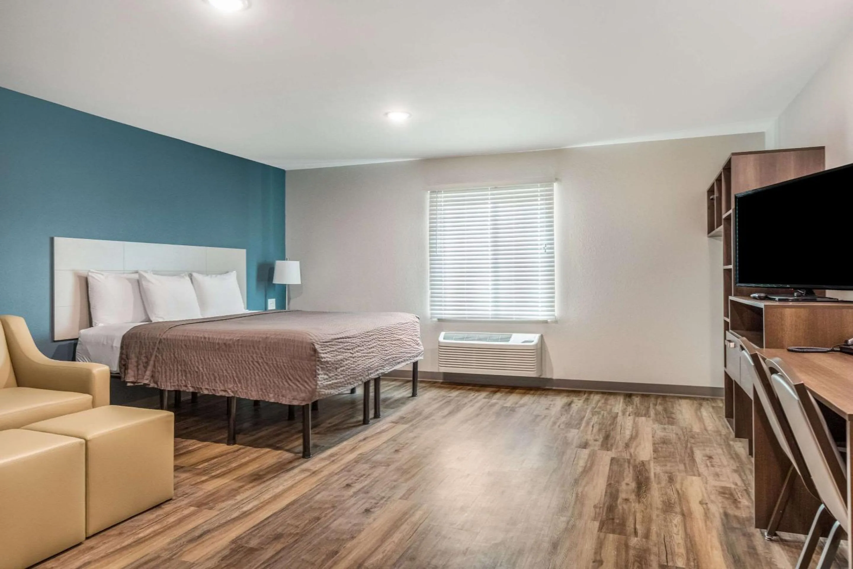 Photo of the whole room, Bed in WoodSpring Suites Greenville Haywood Mall